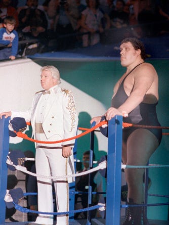 Andre the Giant makes his way to the ring, along with manager Bobby "The Brain" Heenan. The villains were pelted by trash from fans, both heading to and from the ring.