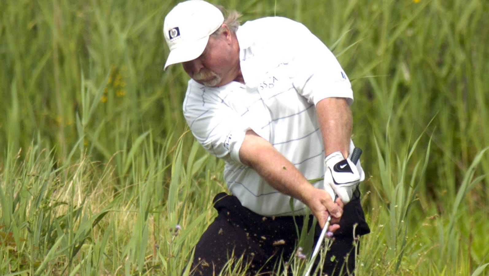 Craig Stadler plays out of the rough at the 2004 Senior Players at the TPC of Michigan in Dearborn.
