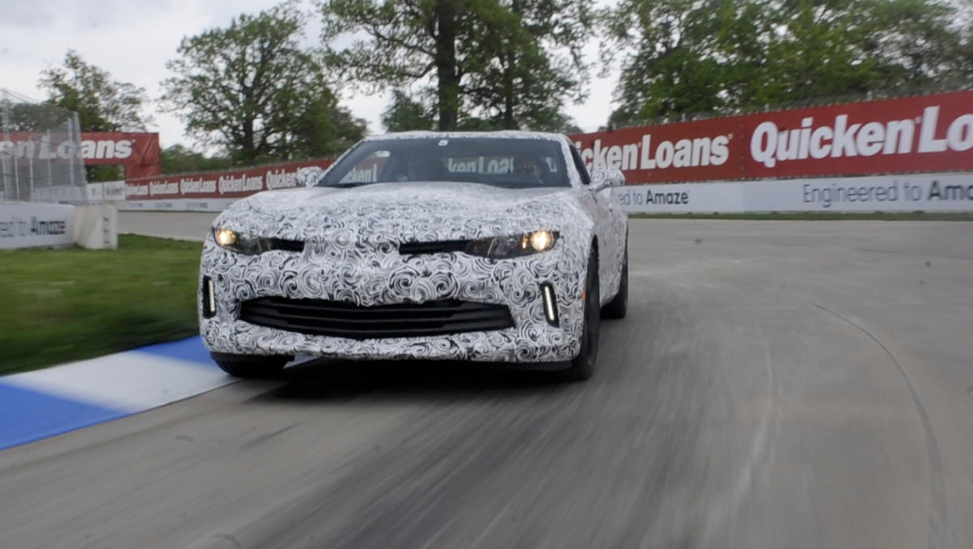 The 2016 Camaro mule car takes a corner, Sunday May 17, 2015, during a test day with the new Chevrolet Camaro on the Grand Prix track at Belle Isle in Detroit.