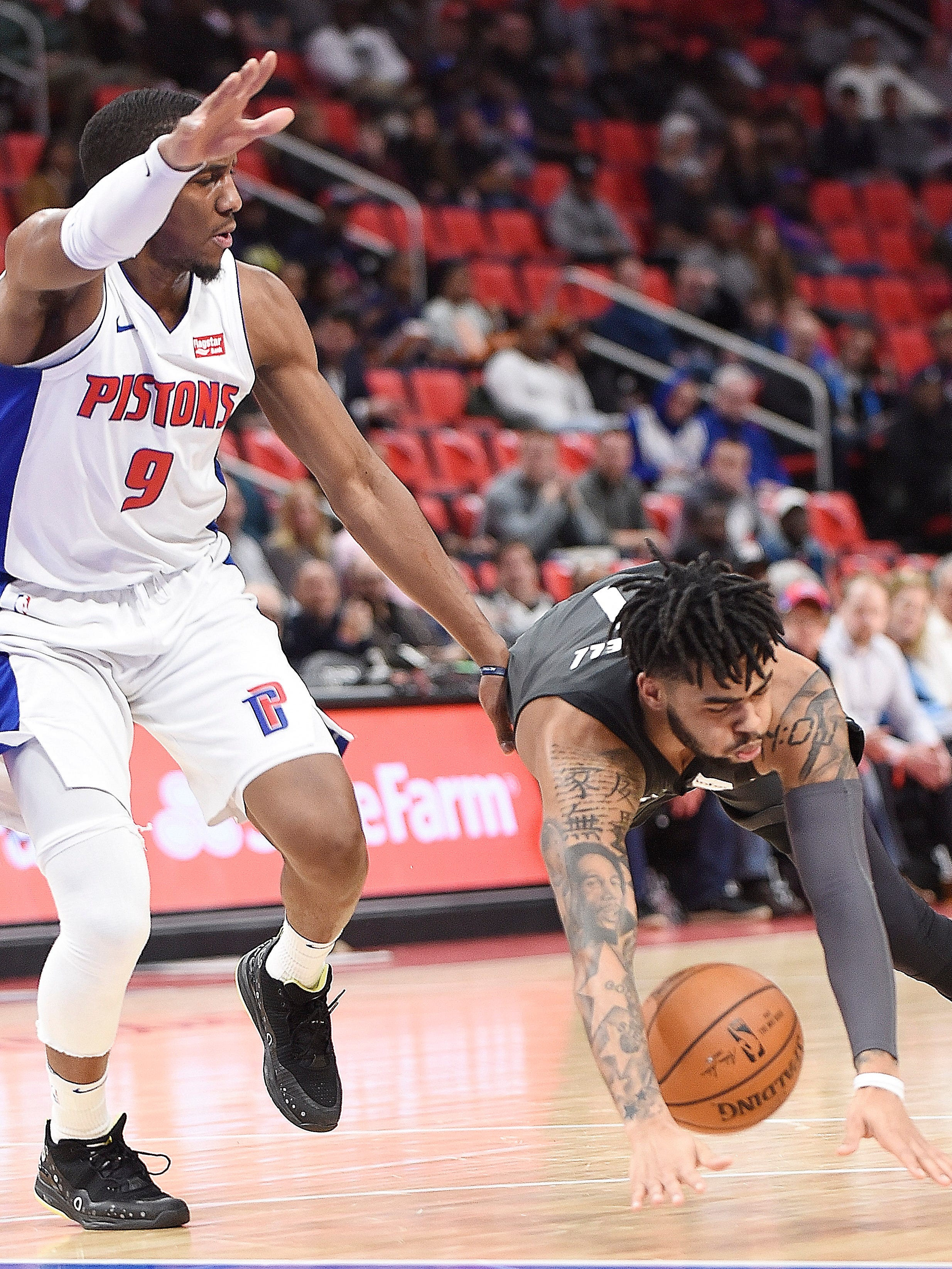 Pistons' Langston Galloway fouls Nets' D' Angelo Russell in the second quarter.