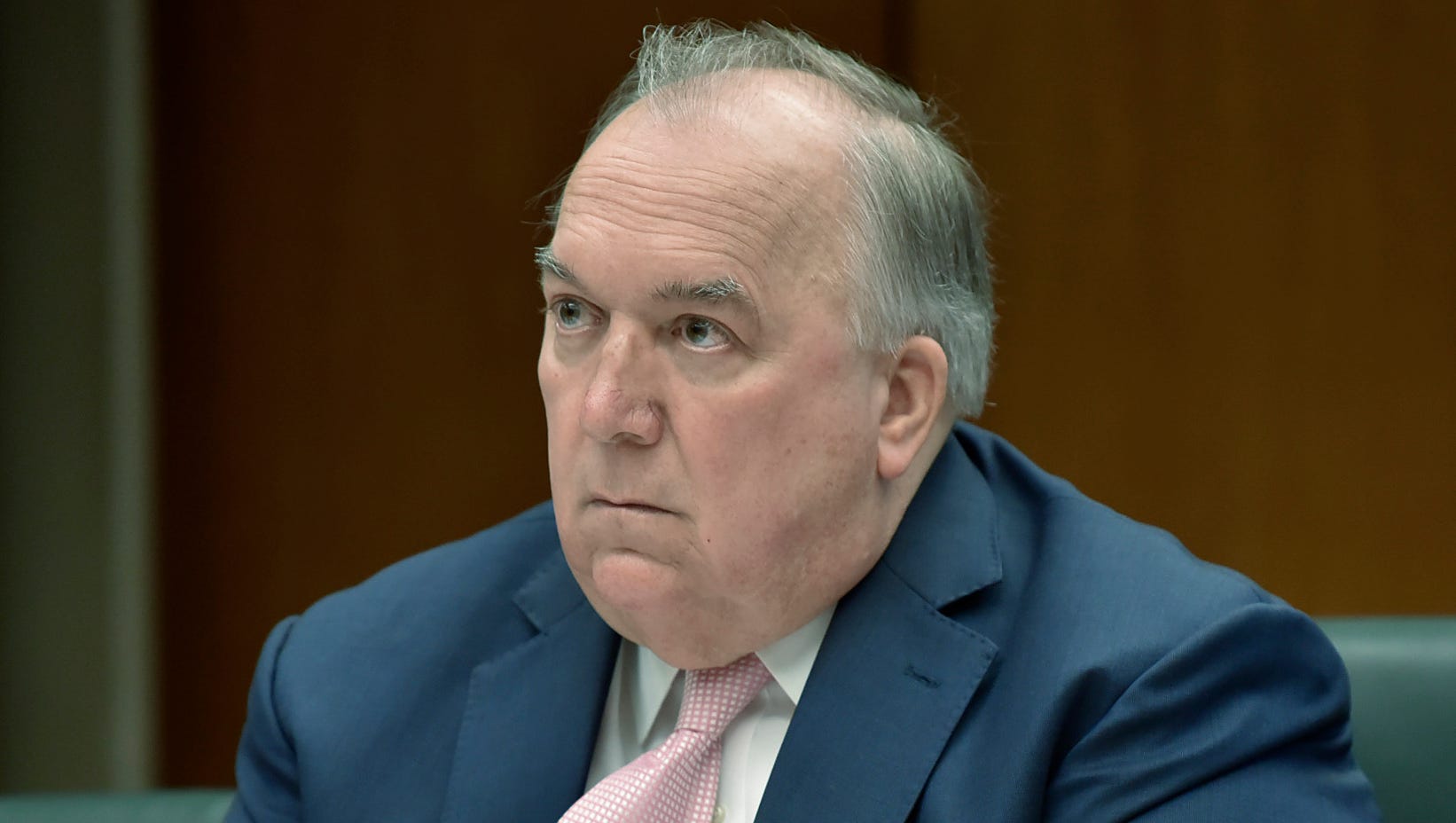 MSU Interim President John Engler listens to public statements, some of them calling for his ouster, during an Action Meeting of the Michigan State University Board of Trustees in the Hannah Administration Building, Friday morning, June 22, 2018.