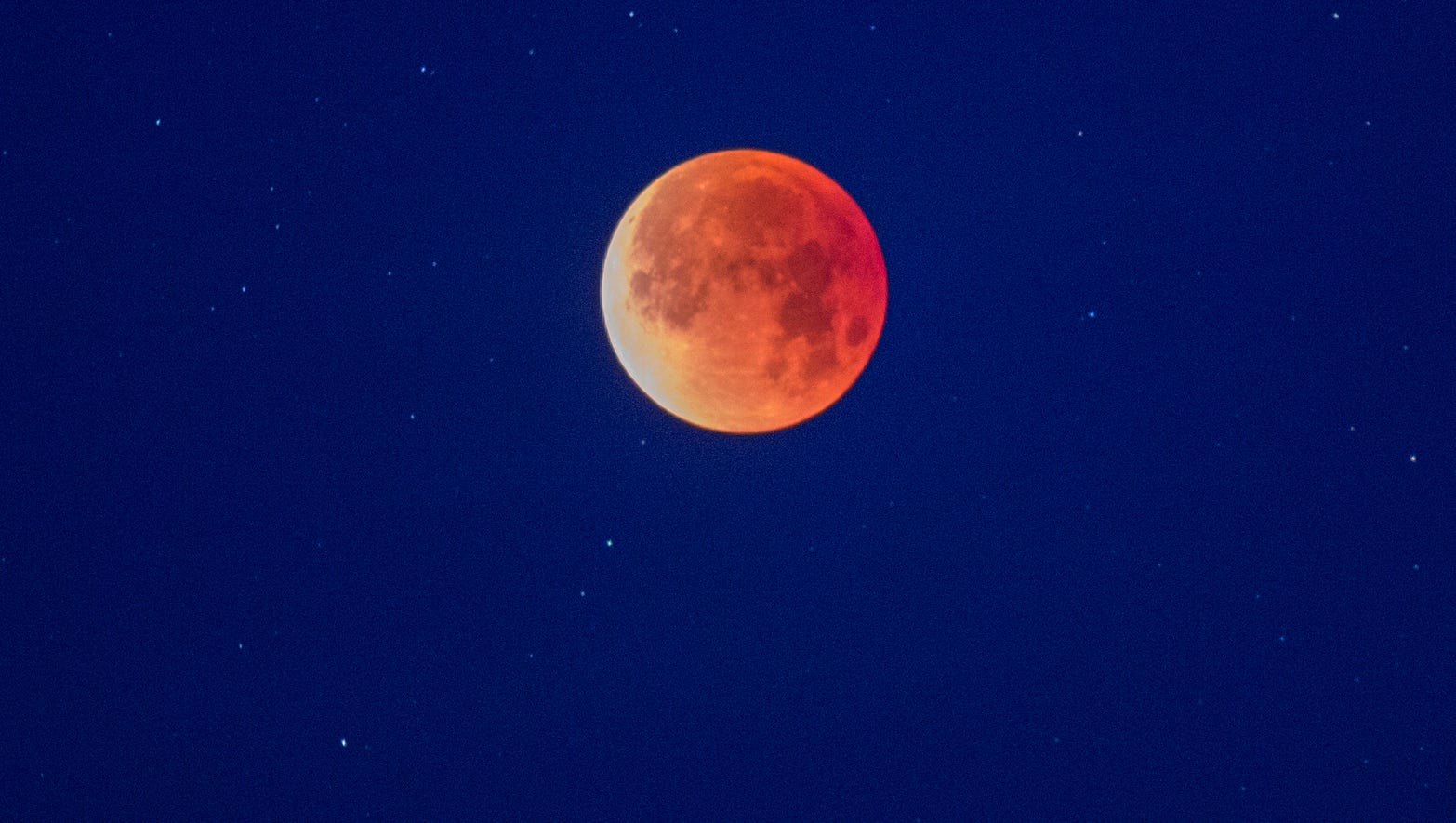 A so-called 'super blue blood moon' is seen in total eclipse above the Mojave Desert on January 31, 2018 near Amboy, California.  The super wolf blood moon will be visible Sunday, Jan. 20.