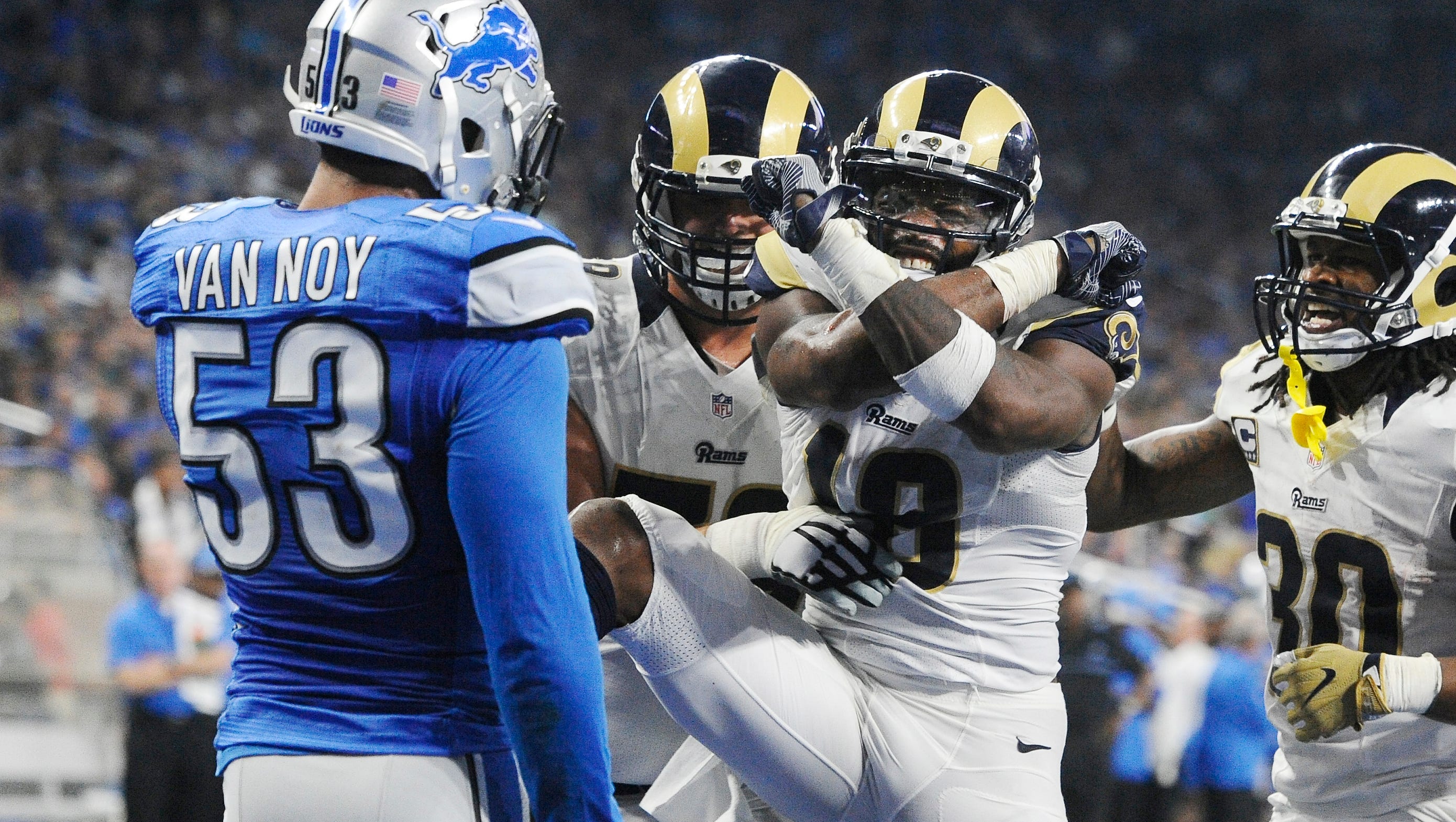 Rams wide receiver Kenny Britt celebrates a touchdown reception run in front of Lions Kyle Van Noy in the fourth quarter.