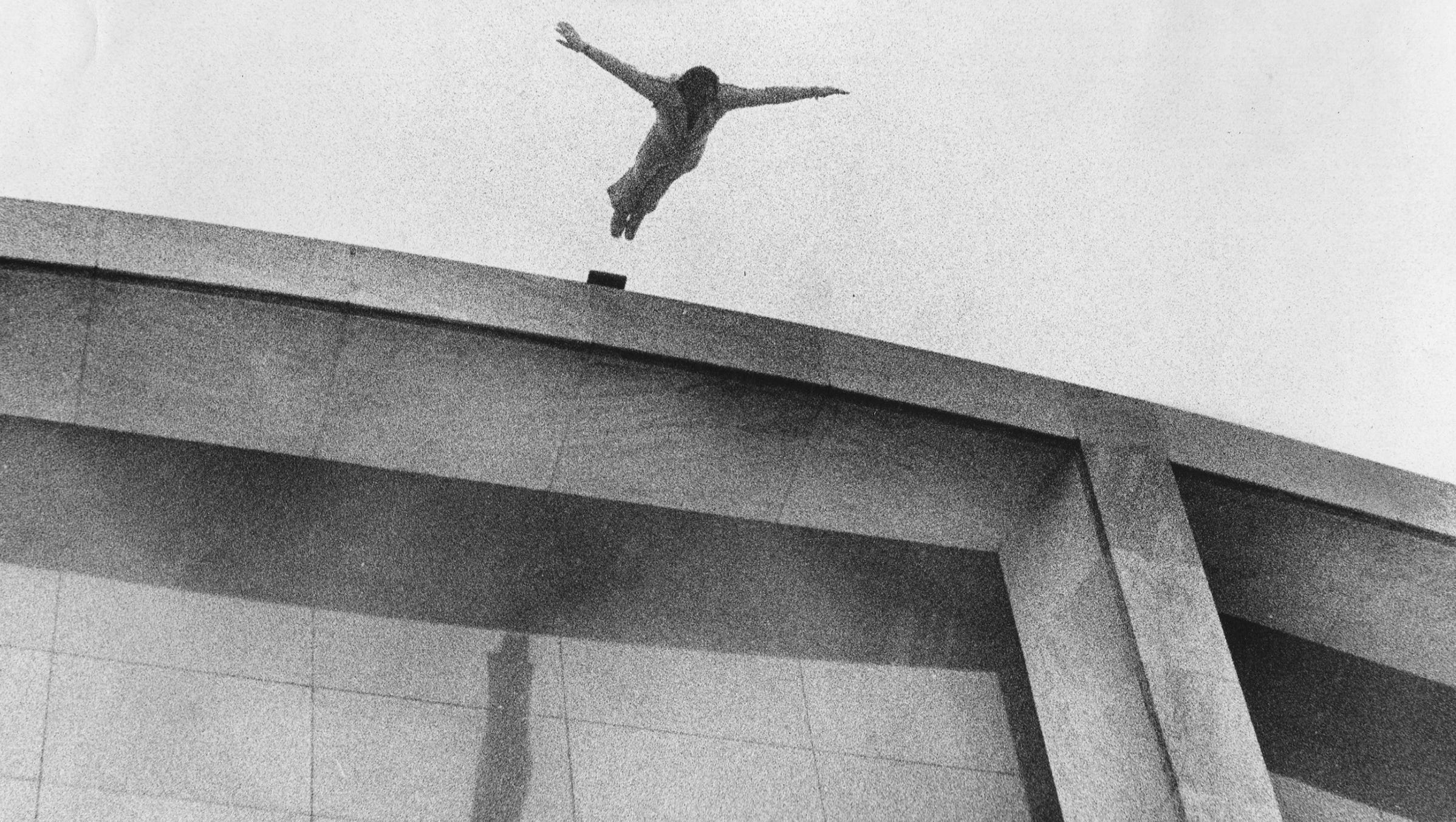 A stuntman dives from Cobo's roof on Dec. 30, 1975.