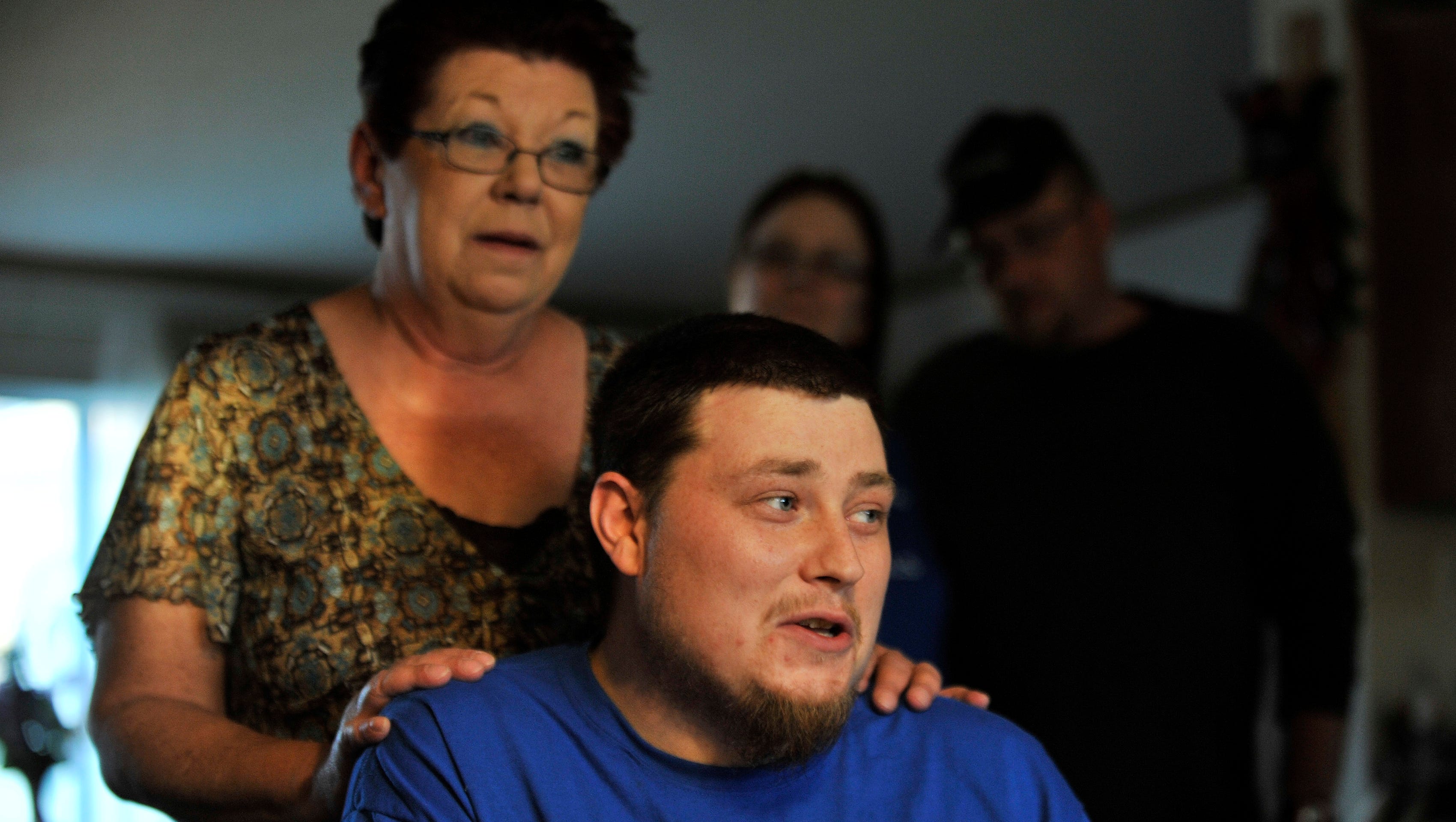 With his mother, Sallie Gutherie, Lucas Gutherie, 26, discusses having ALS after a Sunday family meal at Sallie's home in Addison Township on Nov. 2, 2014. Lucas, 26, has the same disease that killed his father, Chuck, last year. The Sunday family meal has become a tradition since his father's diagnosis.