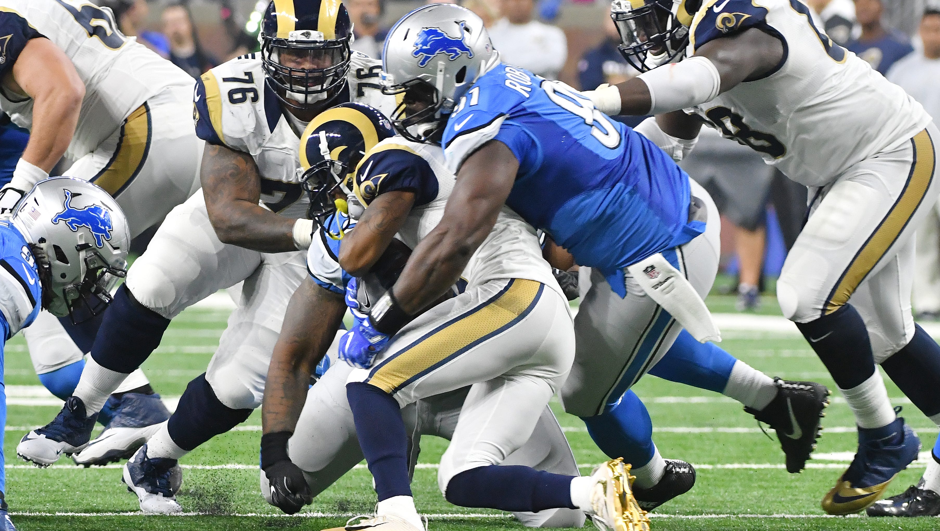 Lions A'Shawn Robinson brings down Rams Tavon Austin at the line of scrimmage in the second quarter.