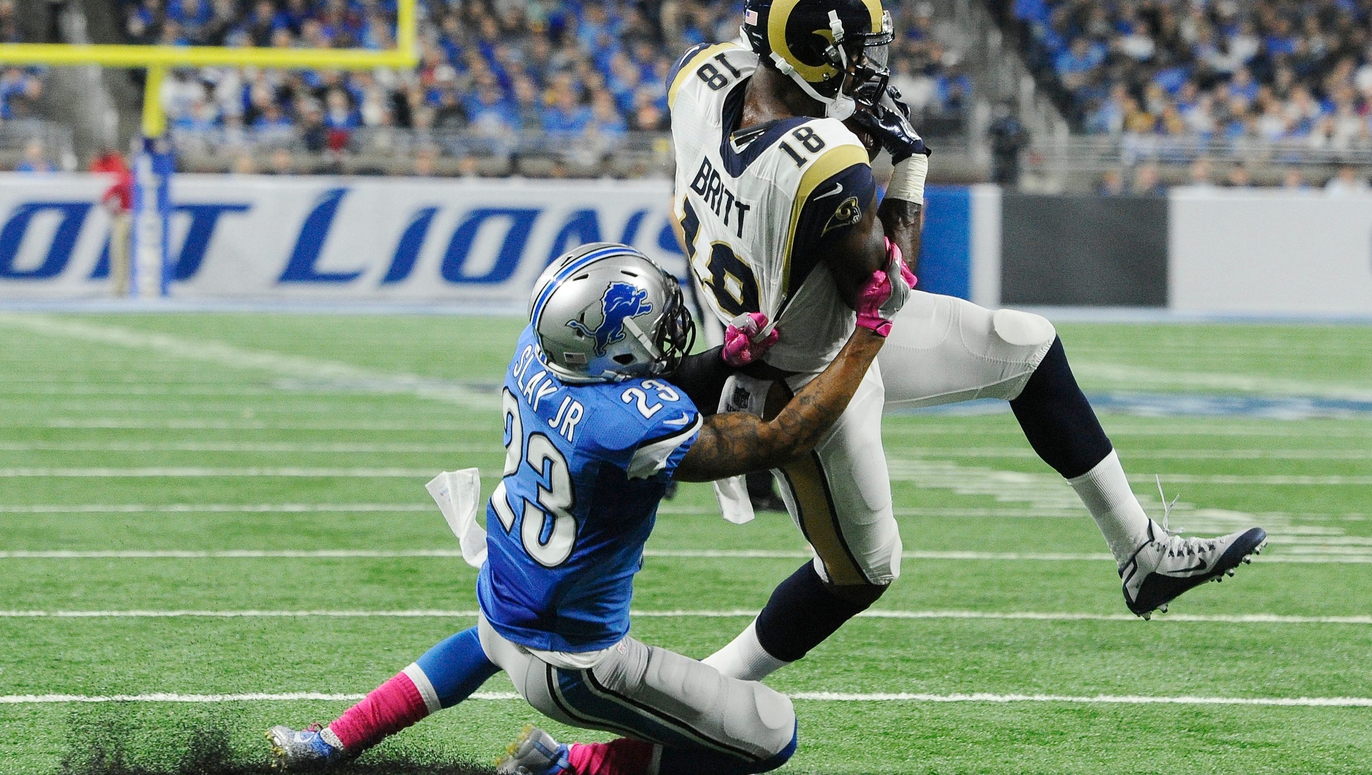 Rams wide receiver Kenny Britt pulls in a reception and is able to throw off Lions cornerback Darius Slay, going into the end zone for a touchdown in the fourth quarter.