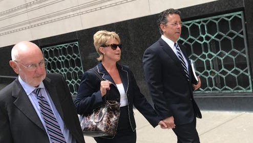 Alphons Iacobelli, far right, leaves the U.S. District Court in Detroit on Aug. 1, 2017, with wife Susanne Piwinski-Iacobelli and lawyer David DuMouchel.