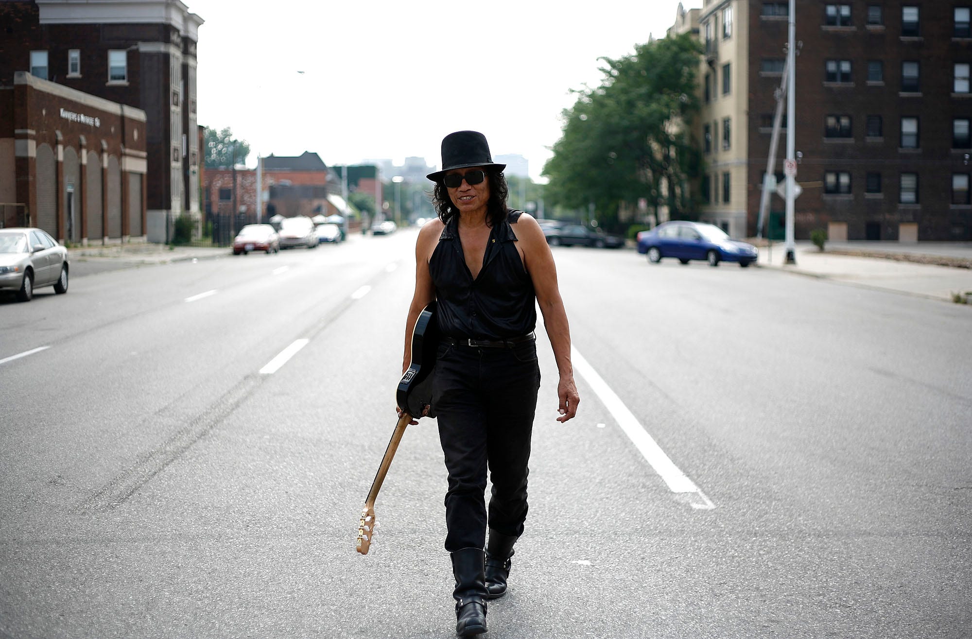 Sixto Rodriguez walks through the Cass Corridor area in Detroit in 2008.