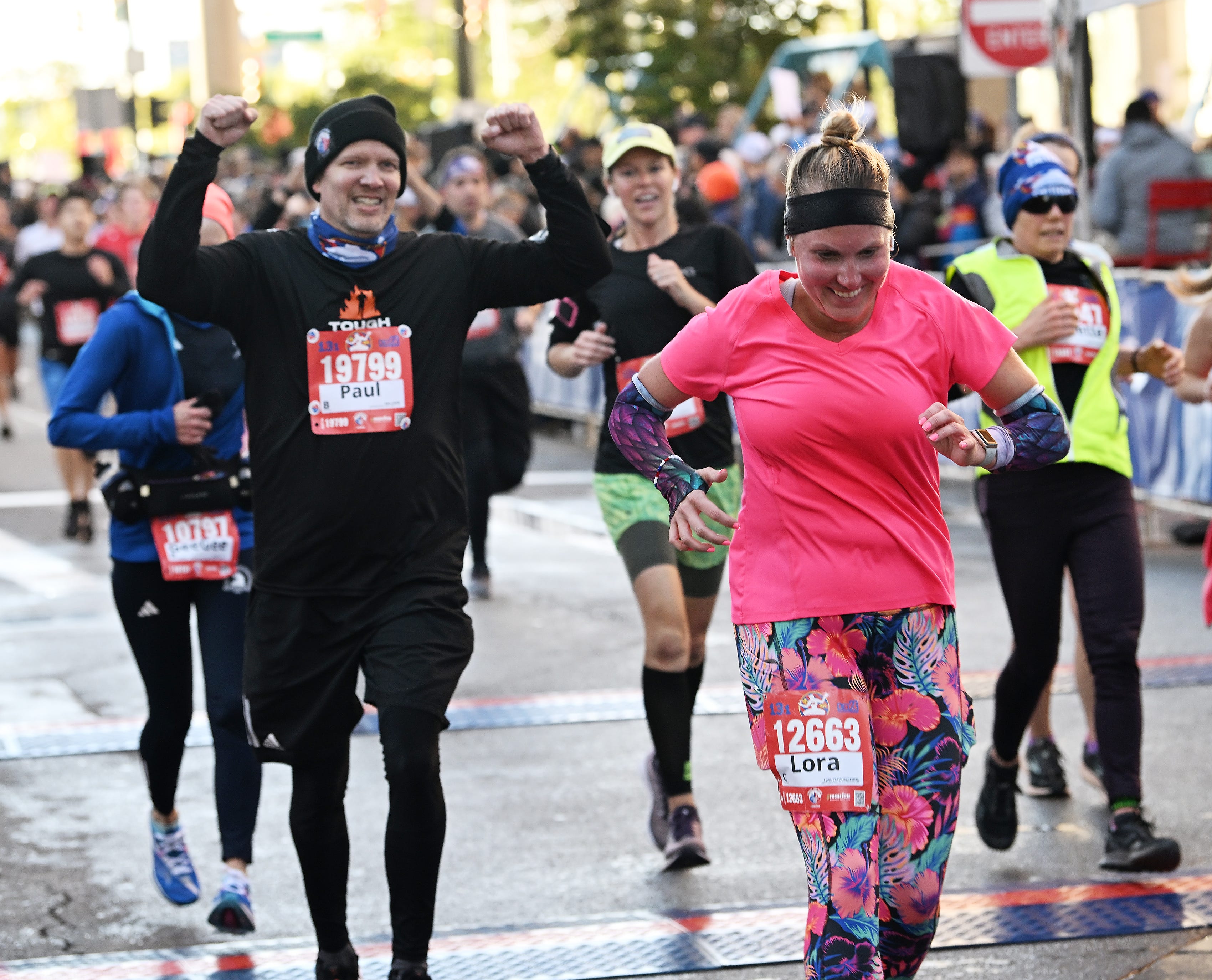 From left, Paul Steepe, 51, of Clinton Township and Lora Graentzdoerffer, 42, of Novi react as they finish the half marathon.