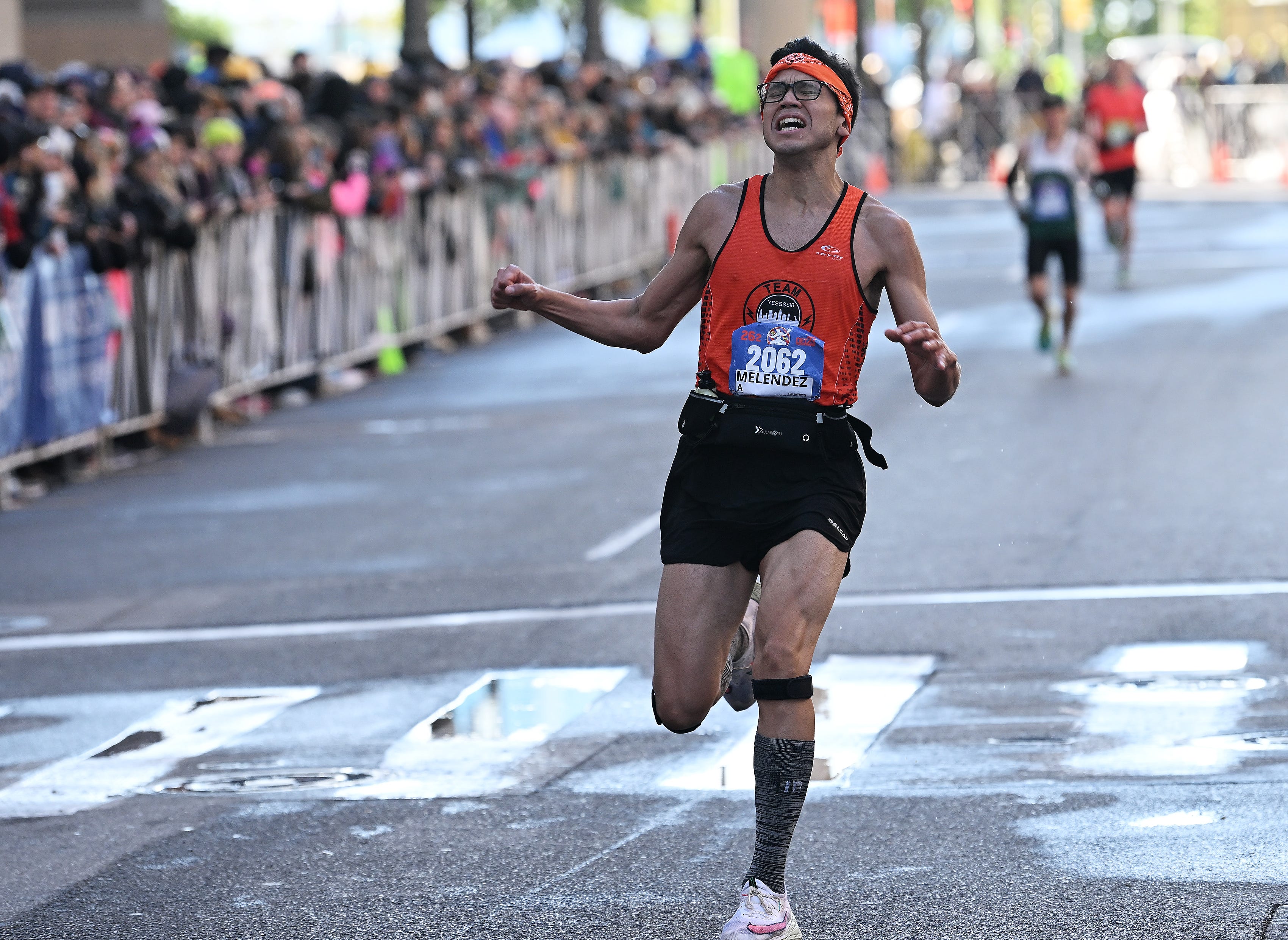 Luis Melendez, 22, of Windsor reacts as he finishes the full marathon at the Detroit Free Press Marathon in Detroit on Oct. 15, 2023. 
(Robin Buckson / The Detroit News)