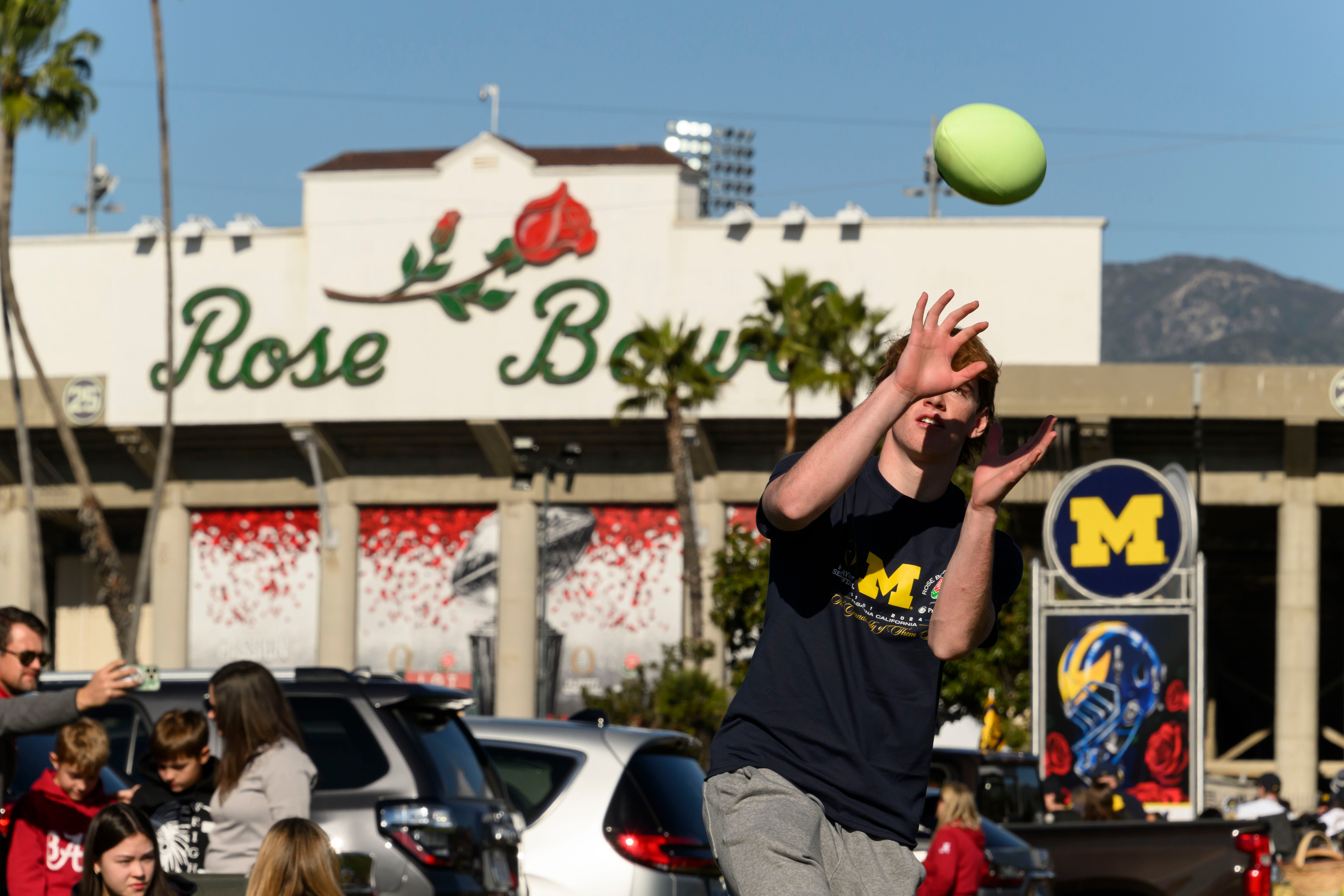 Sixteen-year-old Riley Ulin, of Marin, California, plays catch before the start of the Rose Bowl.