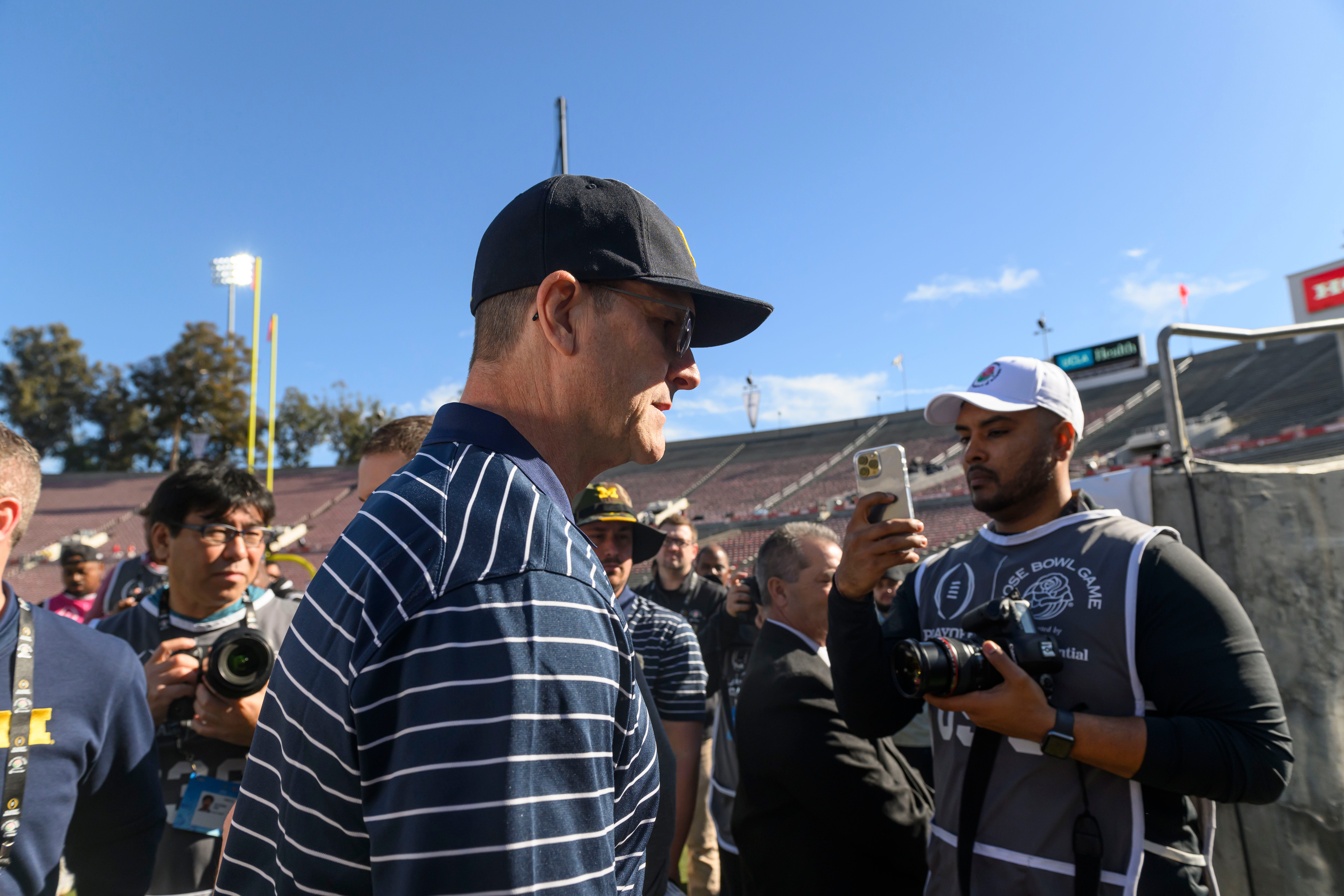 Michigan head coach Jim Harbaugh walks off the field before the start of the Rose Bowl, in Pasadena, California, on Jan. 1, 2024.