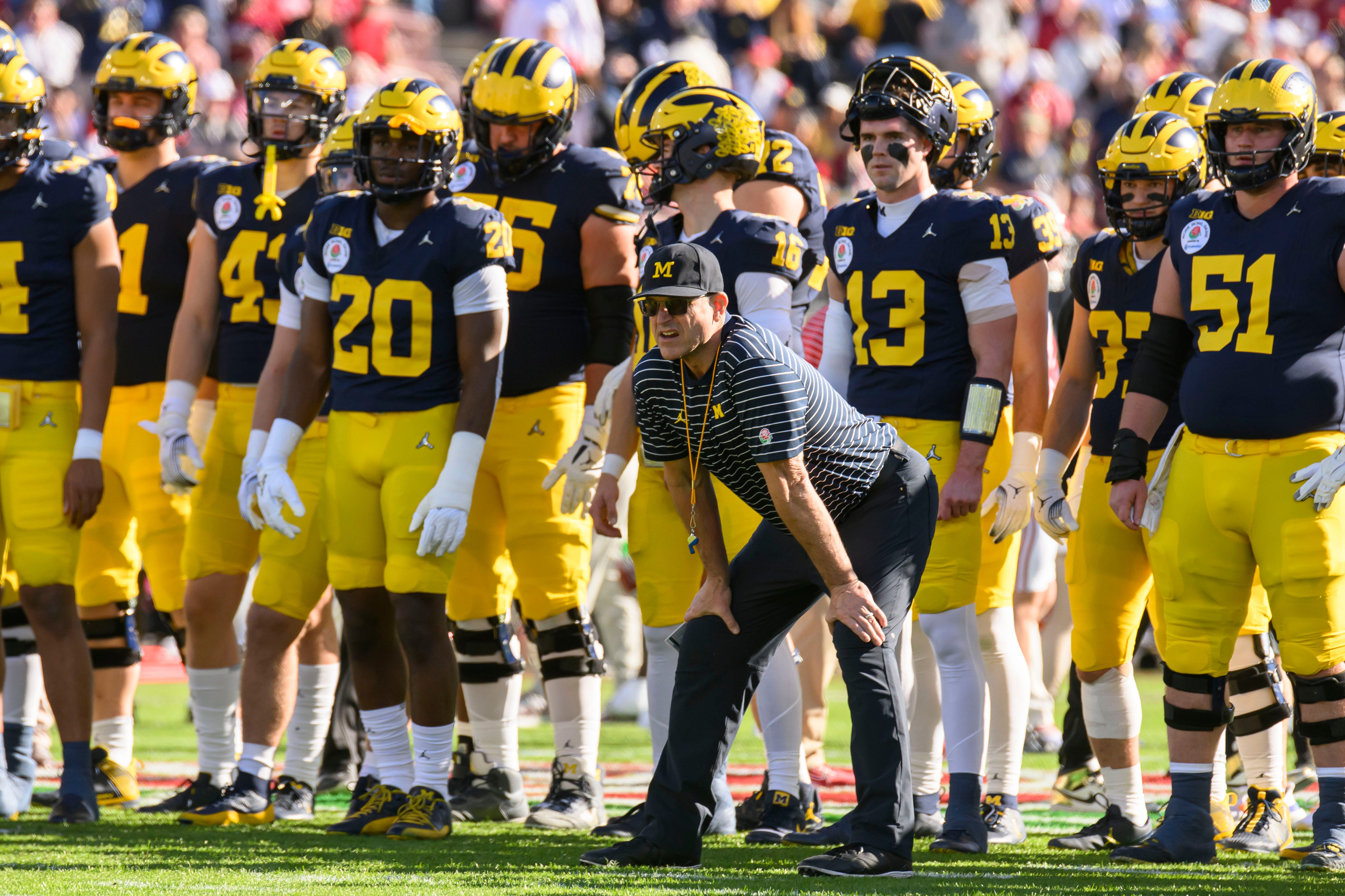 Michigan head coach Jim Harbaugh keeps an eye on his team during warmups before the start of the Rose Bowl, in Pasadena, California, January 1, 2024.