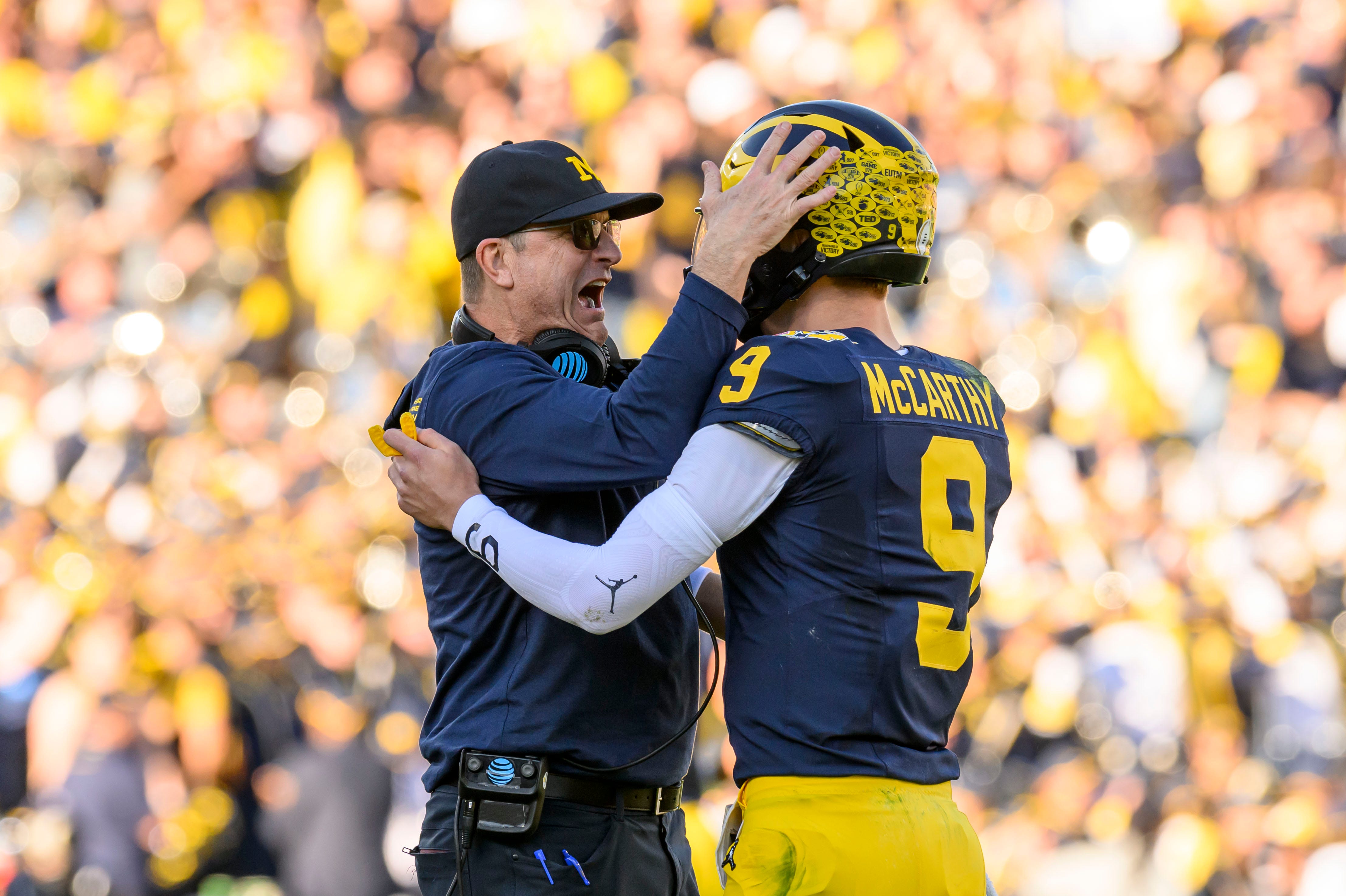 Michigan head coach Jim Harbaugh and quarterback J.J. McCarthy celebrate after Michigan’s first touchdown during the first quarter of the Rose Bowl, in Pasadena, California, January 1, 2024.