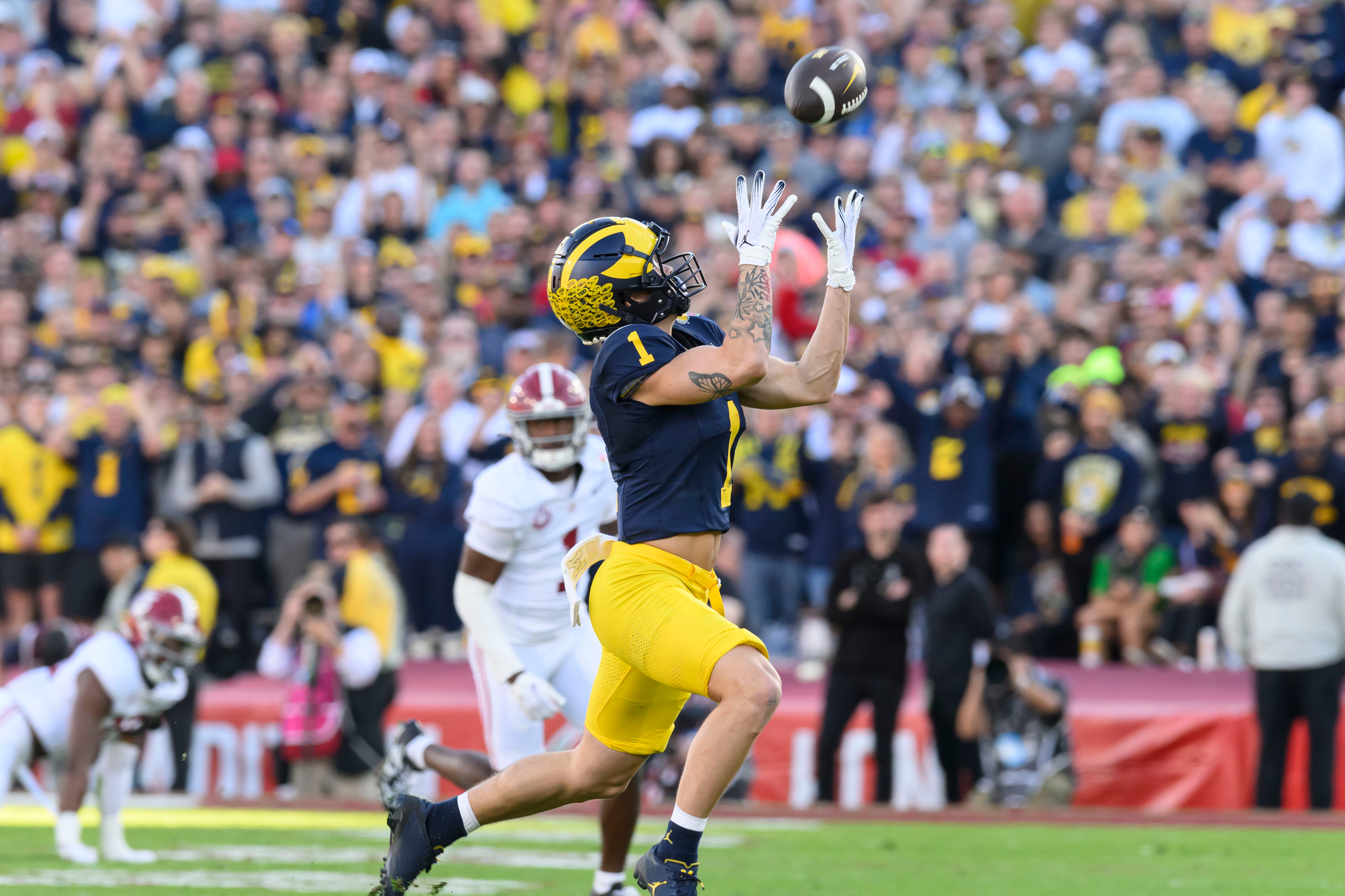 Michigan wide receiver Roman Wilson hauls in a pass for extra yardage during the second quarter of the Rose Bowl, in Pasadena, California, January 1, 2024.