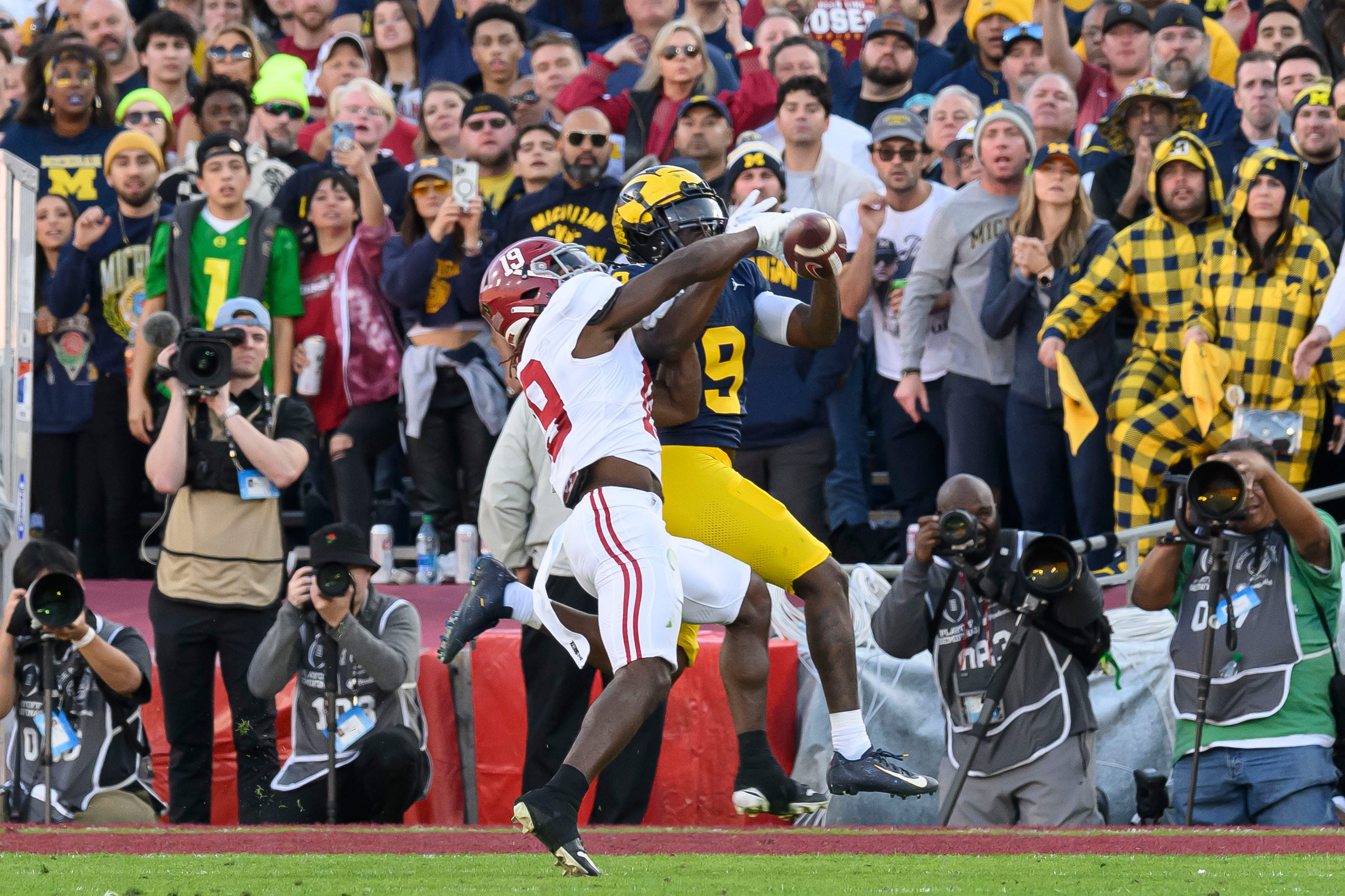 Michigan defensive back Rod Moore deflects a pass intended for Alabama wide receiver Kendrick Law during the second quarter of the Rose Bowl, in Pasadena, California, January 1, 2024.