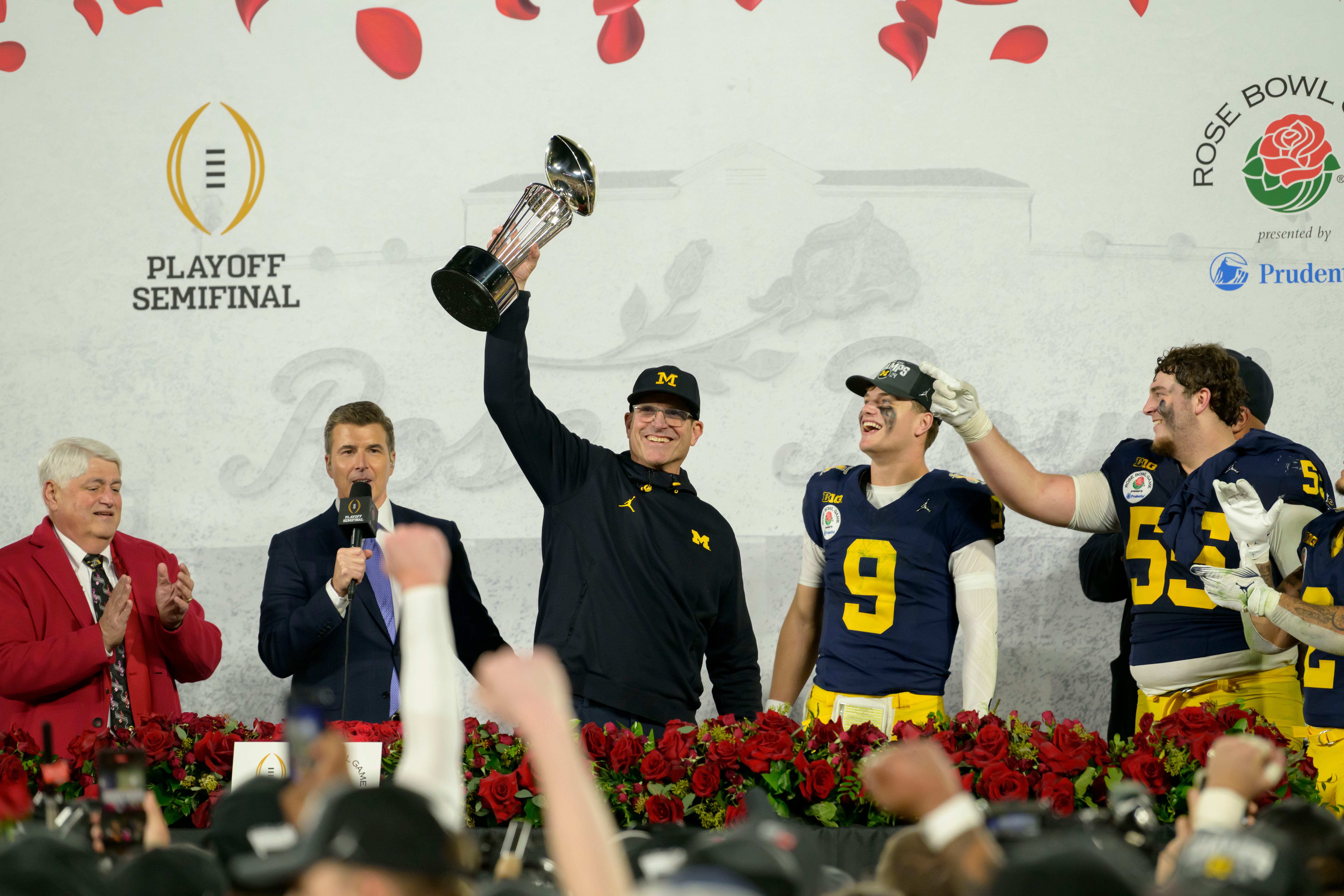 Michigan head coach Jim Harbaugh lifts the Leishman Trophy after the University of Michigan defeated Alabama University 27-20 in overtime at the Rose Bowl, in Pasadena, California, January 1, 2024.