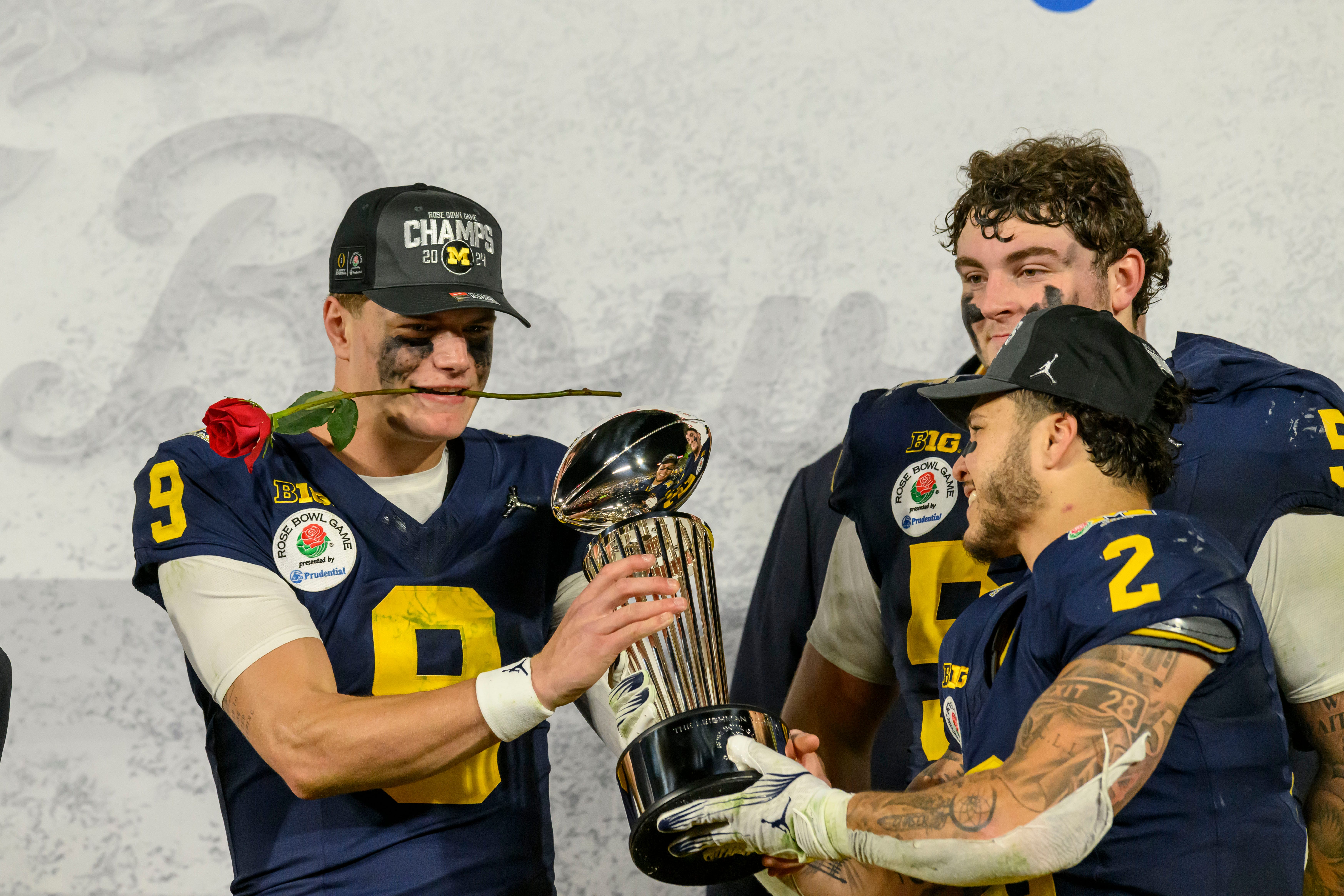 Michigan quarterback J.J. McCarthy, left, and running back Blake Corum with the Leishman Trophy after the University of Michigan defeated Alabama University 27-20 in the Rose Bowl, in Pasadena, California, January 1, 2024.