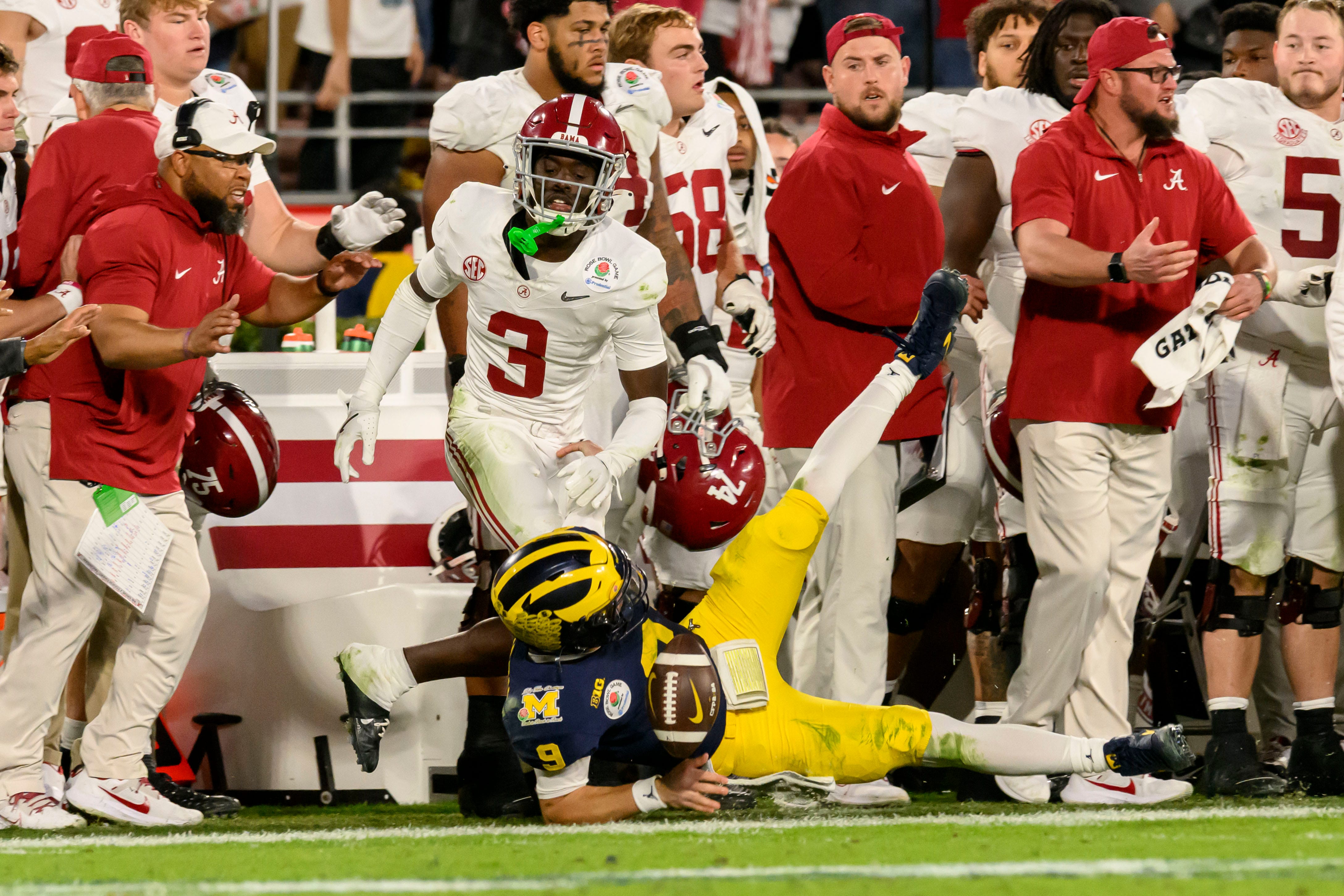 Michigan quarterback J.J. McCarthy hits the ground after running the ball during the fourth quarter of the Rose Bowl, in Pasadena, California, January 1, 2024.