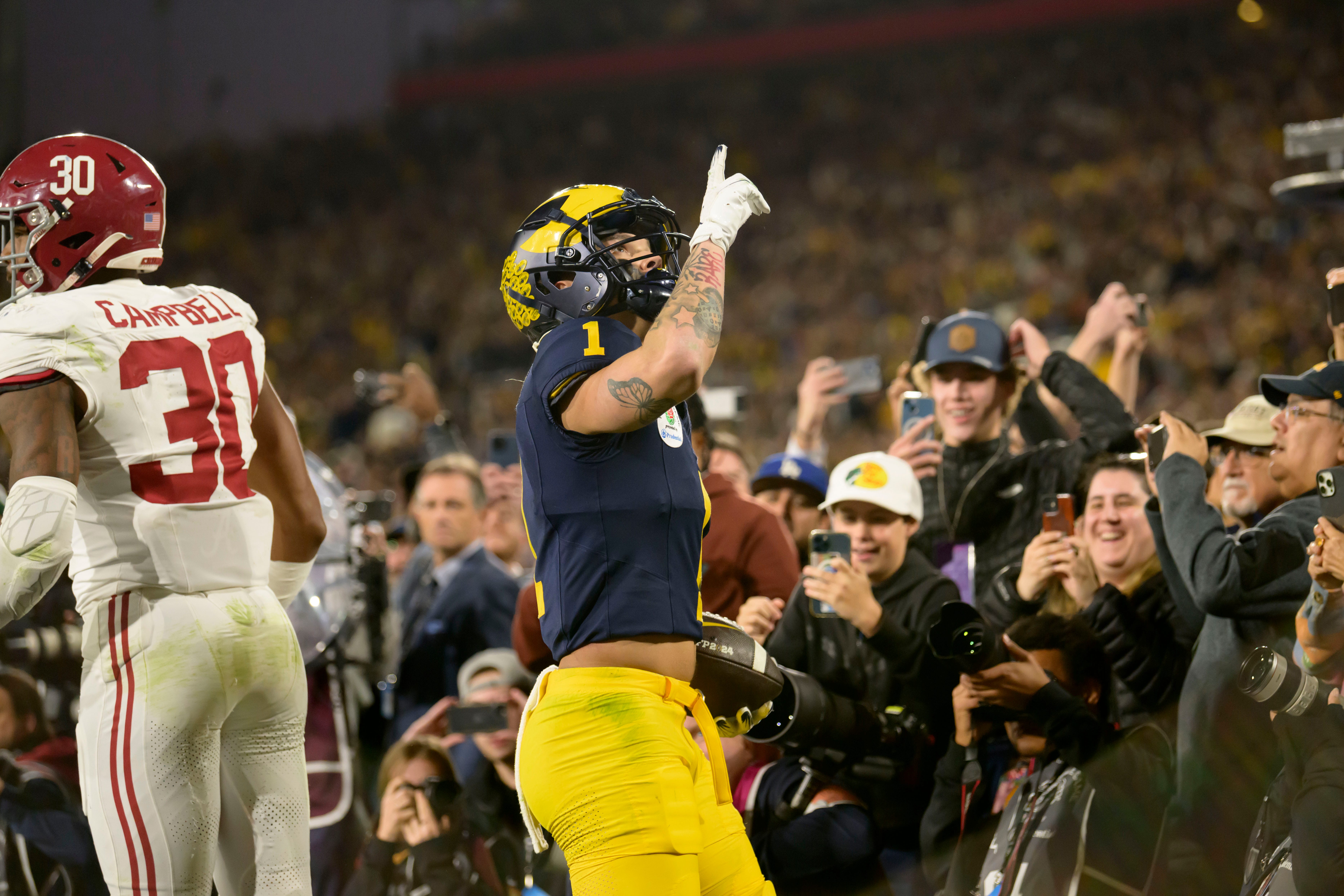 Michigan wide receiver Roman Wilson celebrates after scoring a touchdown late during the fourth quarter of the Rose Bowl, in Pasadena, California, January 1, 2024.