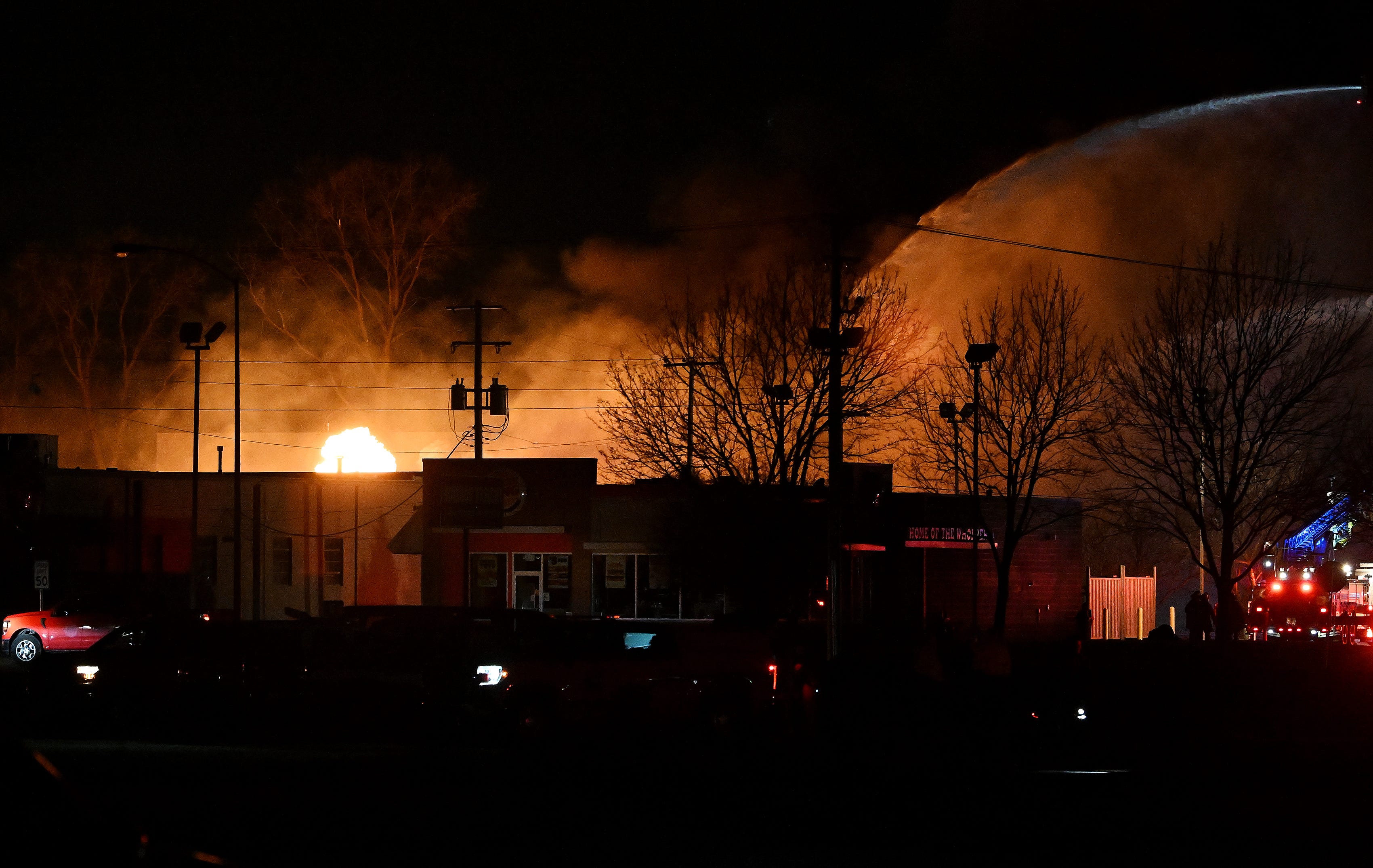Fire departments fight a blaze near 15 Mile Road and Groesbeck Hwy. in Clinton Township, Mich. on Mar 4, 2024. 
(The Detroit News/Robin Buckson)