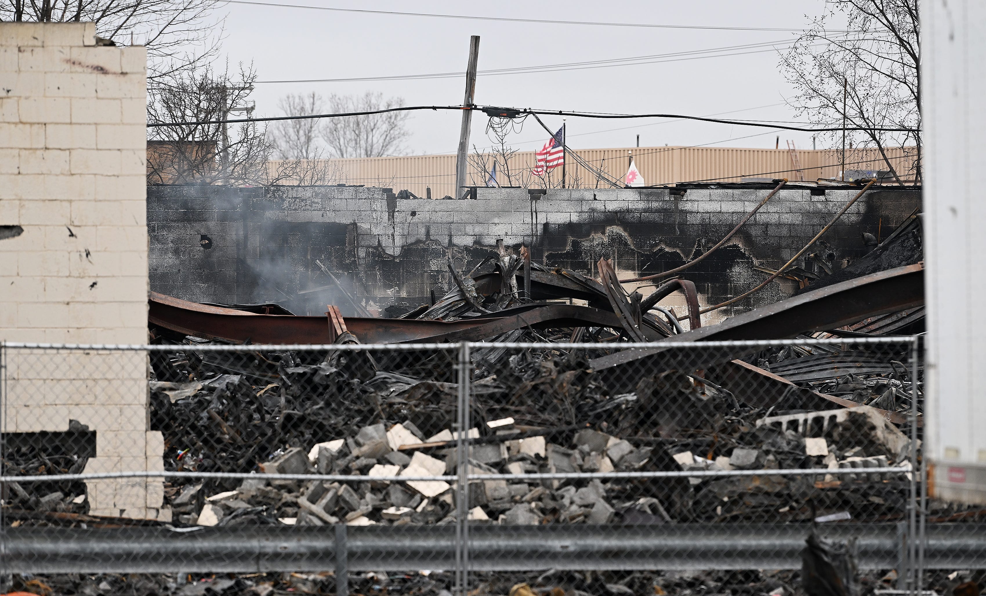 The scene is still smoldering at Select Distributors and Goo LLC in Clinton Township, Mich. on March 5, 2024. Select Distributors was the scene of fire and explosions the night before on March 4, 2024.