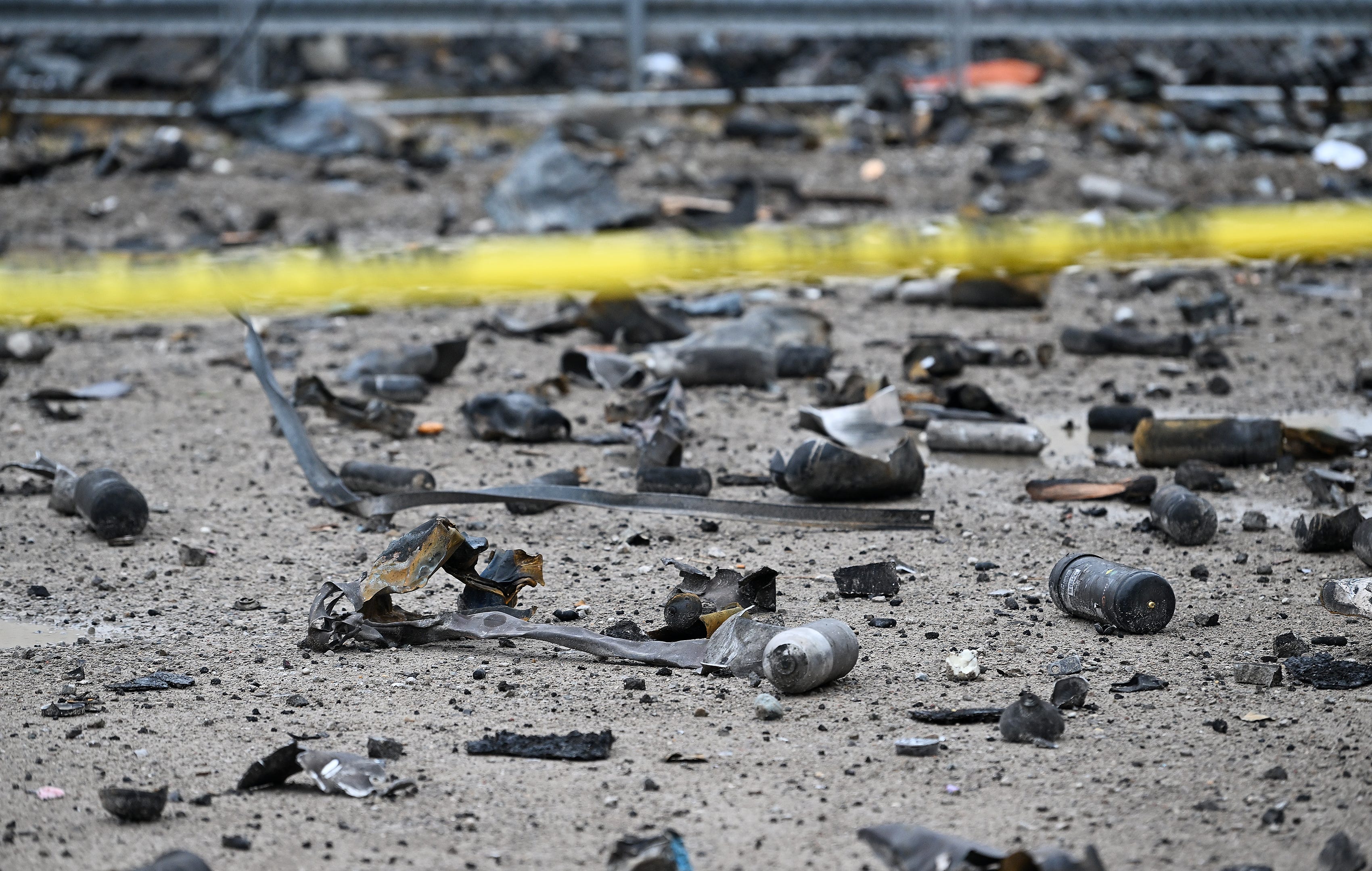Debris, including canisters and knives to name two items, strewn around the area near Select Distributors and Goo LLC in Clinton Township, Mich. on Mar. 5, 2024. Select Distributors was the scene of fire and explosions the night before on March 4, 2024.