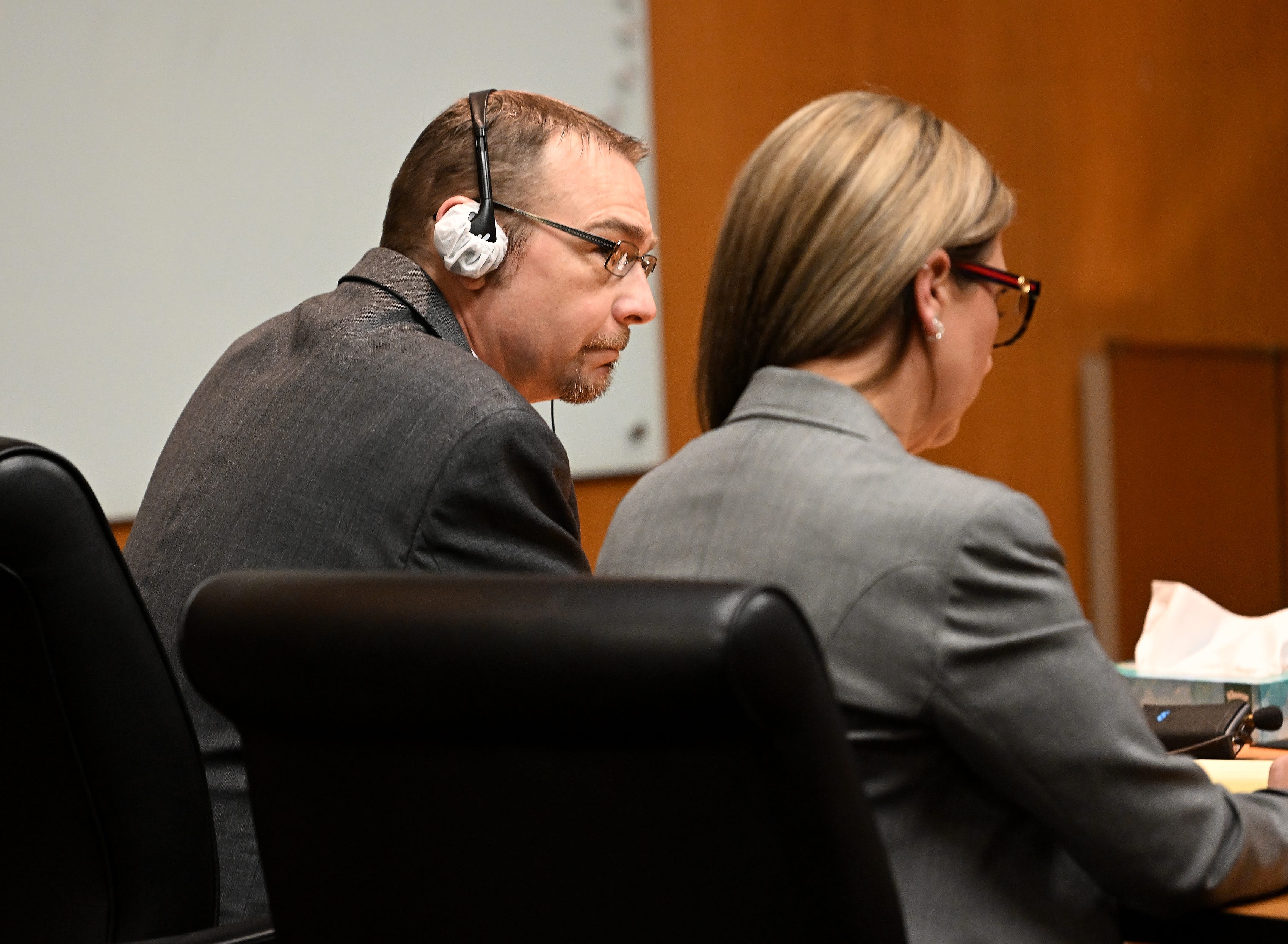 James Crumbley and his attorney Mariell Lehman listen to the verdict, as the jury finds Crumbley guilty of involuntary manslaughter in the courtroom of Cheryl Matthews in Oakland County Court in Pontiac, Mich. on March 14, 2024. James Crumbley was judged partly responsible for the actions of his son Ethan, who is serving a life sentence for killing four classmates at Oxford High School.