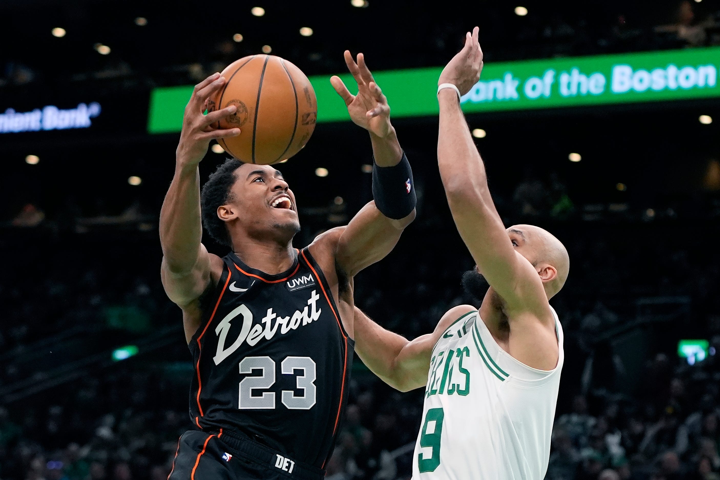 Detroit Pistons' Jaden Ivey (23) shoots against Boston Celtics' Derrick White (9) during the first half of an NBA basketball game, Monday, March 18, 2024, in Boston. The Celtics win, 119 to 94.