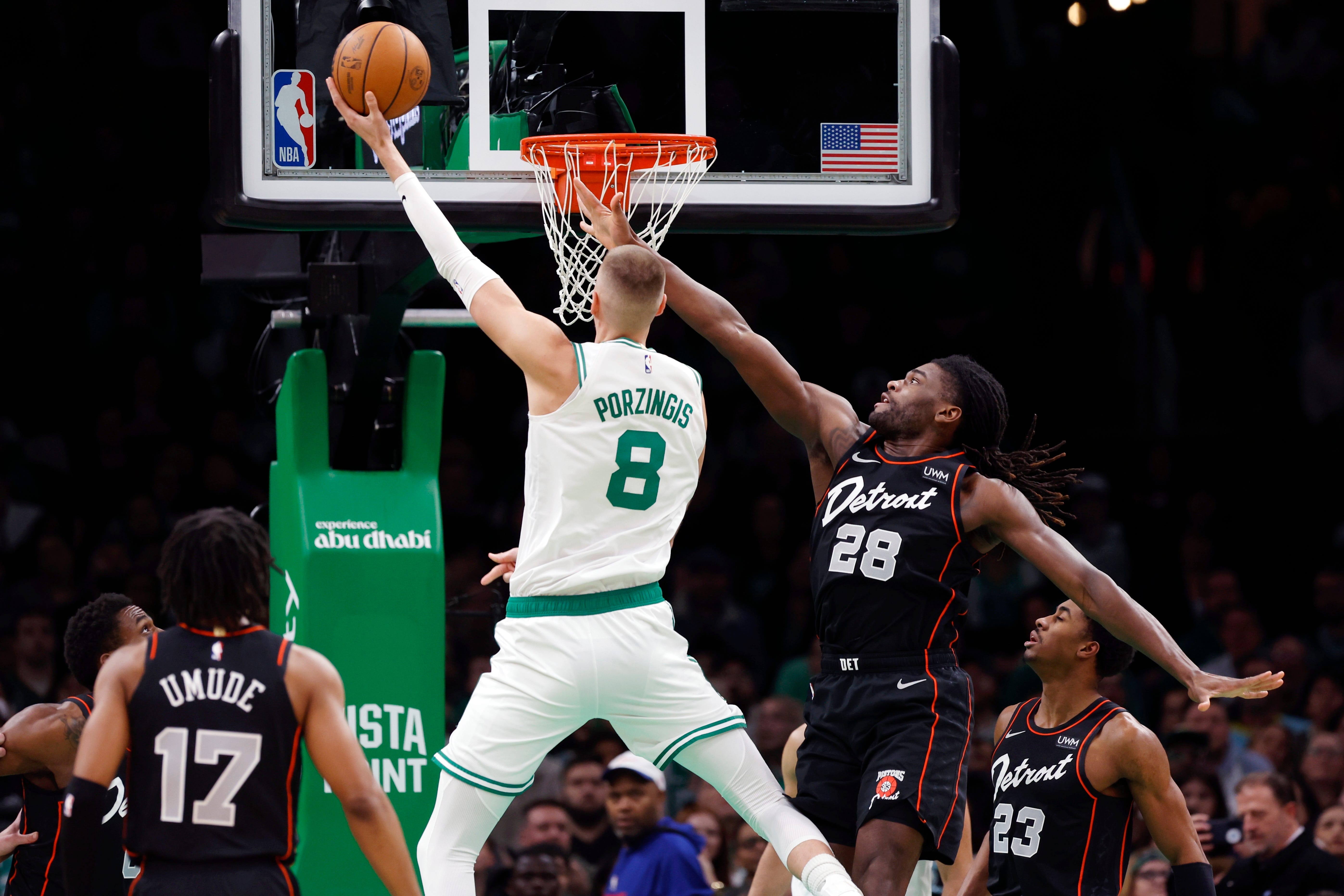 Boston Celtics' Kristaps Porzingis (8) shoots against Detroit Pistons' Isaiah Stewart (28) during the first half.