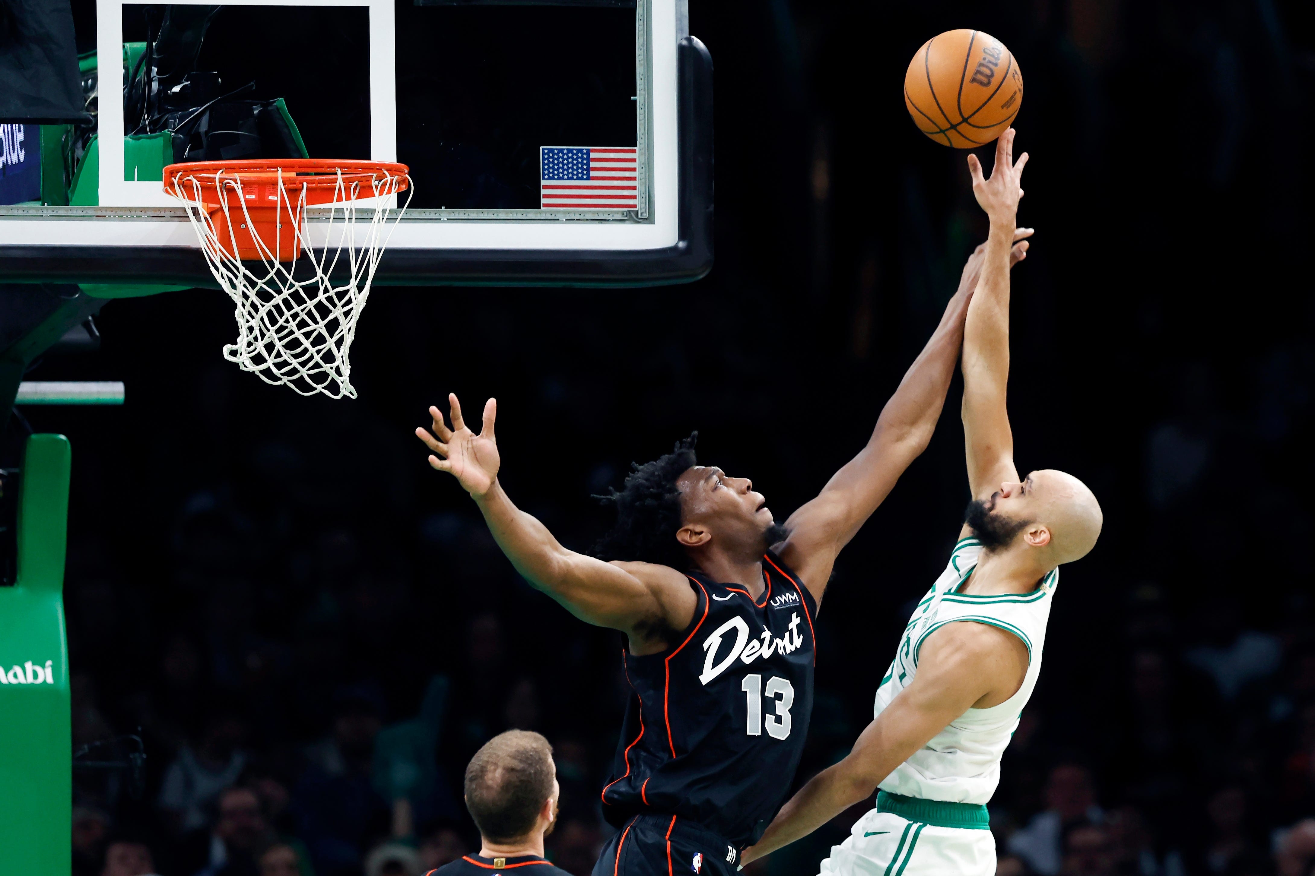 Boston Celtics' Derrick White, right, shoots against Detroit Pistons' James Wiseman (13) during the first half.