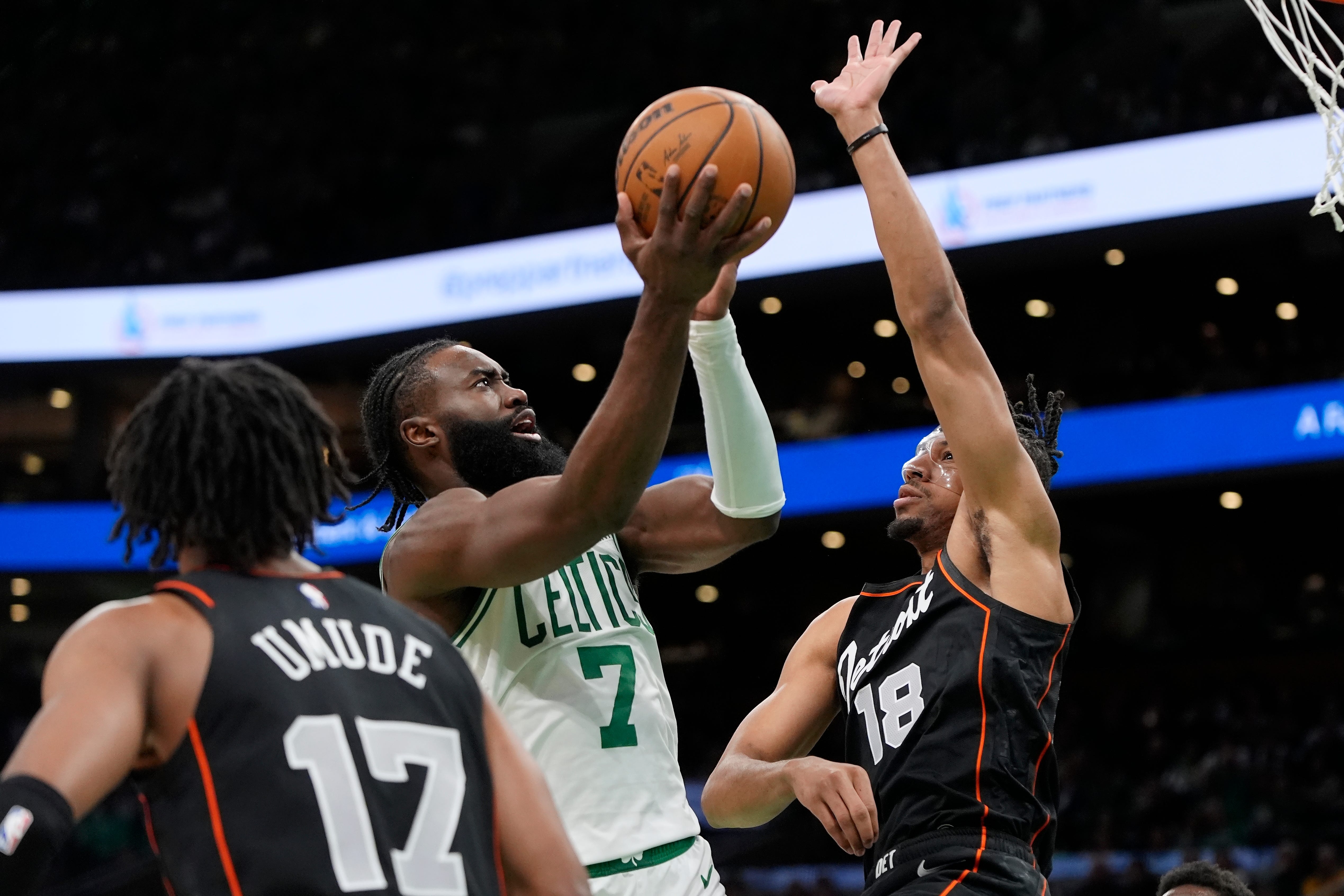 Boston Celtics' Jaylen Brown (7) shoots against Detroit Pistons' Tosan Evbuomwan (18) during the second half.