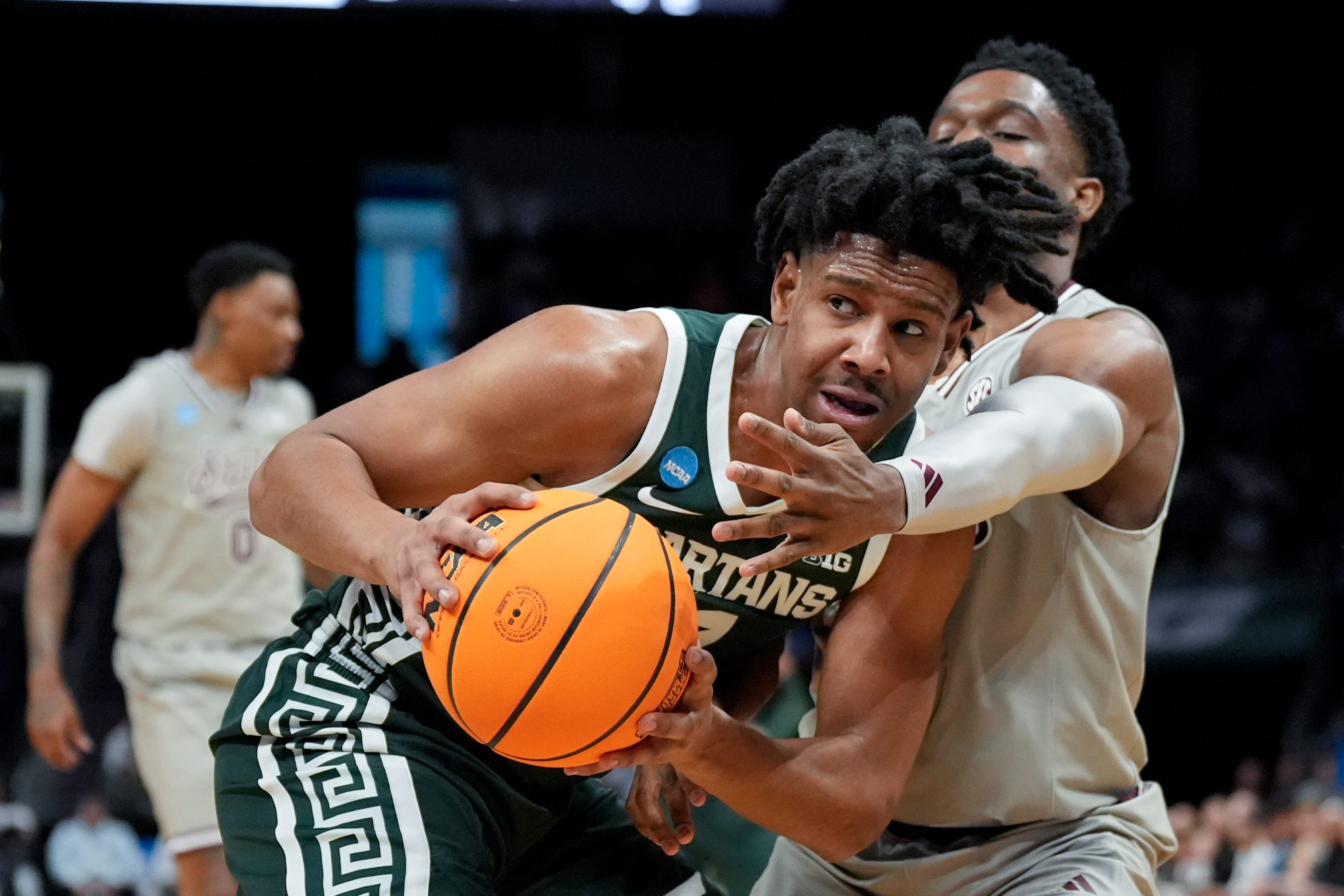 Michigan State guard A.J. Hoggard drives to the basket past Mississippi State guard Josh Hubbard during the first half.