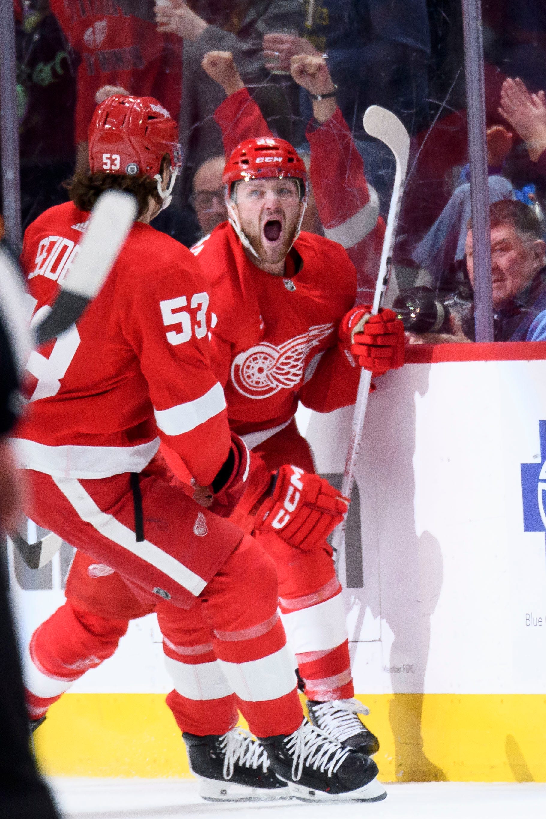 Detroit Red Wings right wing Christian Fischer, right, celebrates with defenseman Moritz Seider after scoring a goal during the second period.