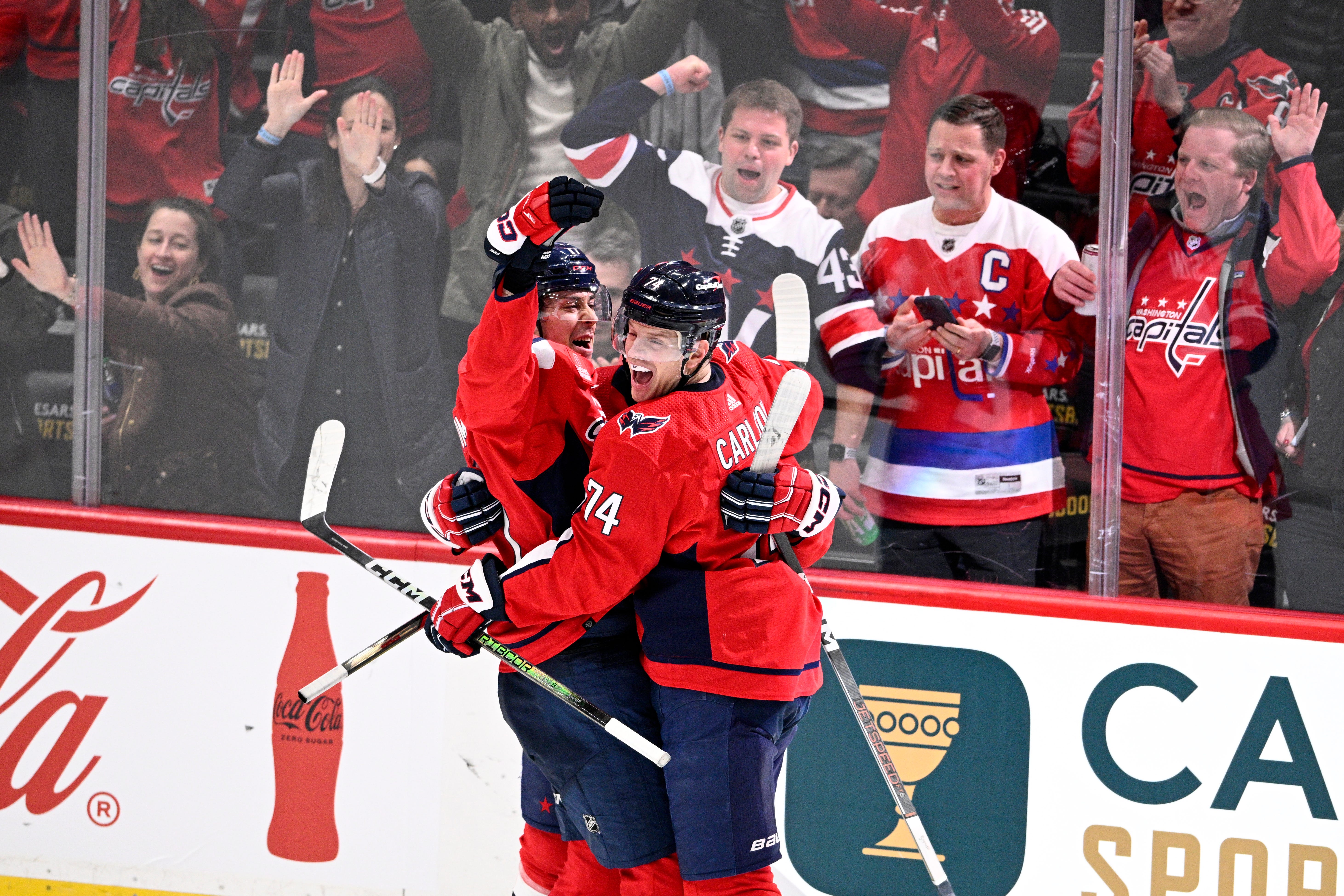 Washington Capitals center Dylan Strome, left, celebrates his game-winning goal with defenseman John Carlson (74) in overtime.