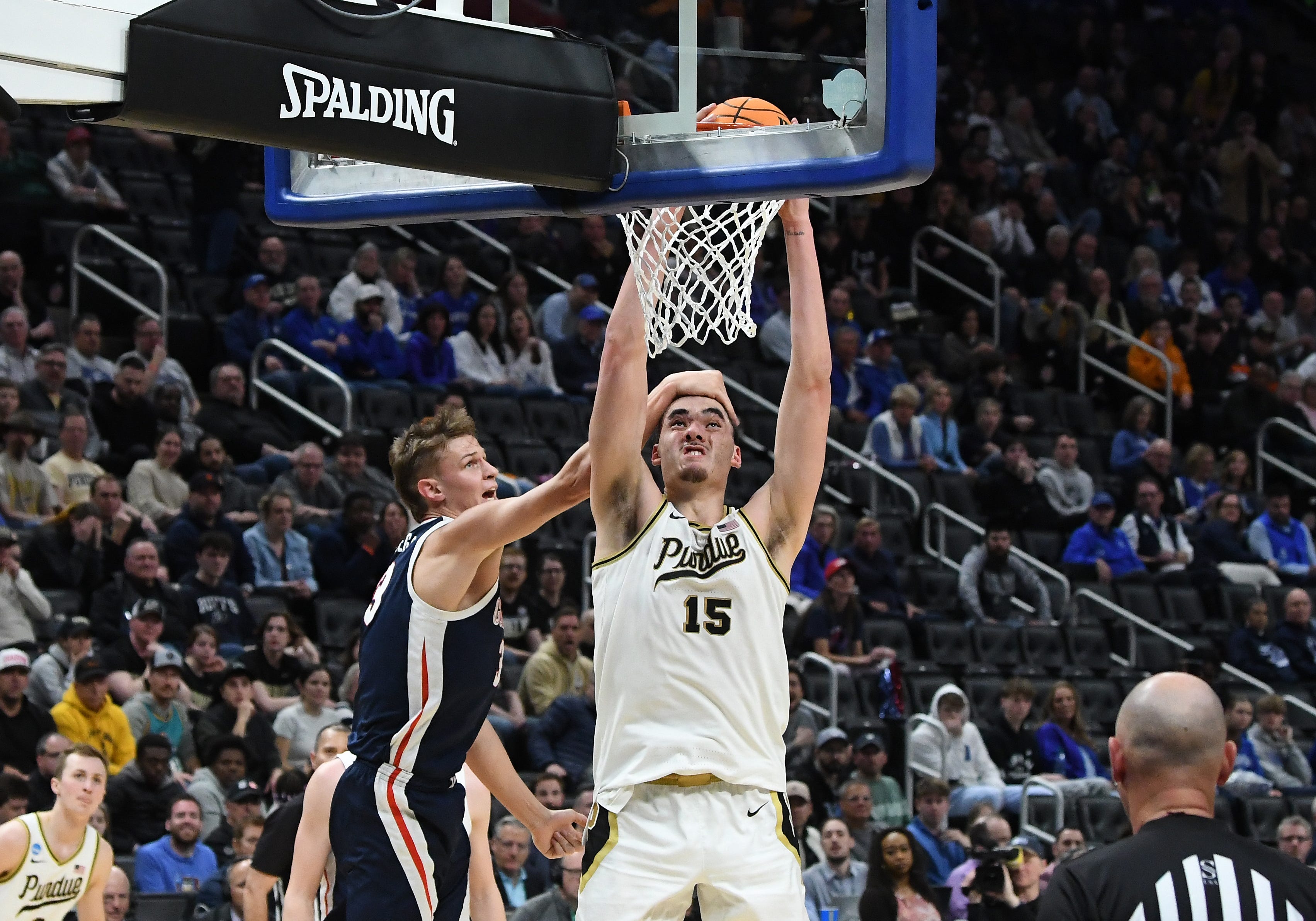 Gonzaga’s Ben Gregg gets a hand on Purdue’s Zach Edey as he slams home a dunk in the first half in the NCAA Midwest Regional semi-final at Little Caesars Arena in Detroit, Michigan on March 29, 2024.