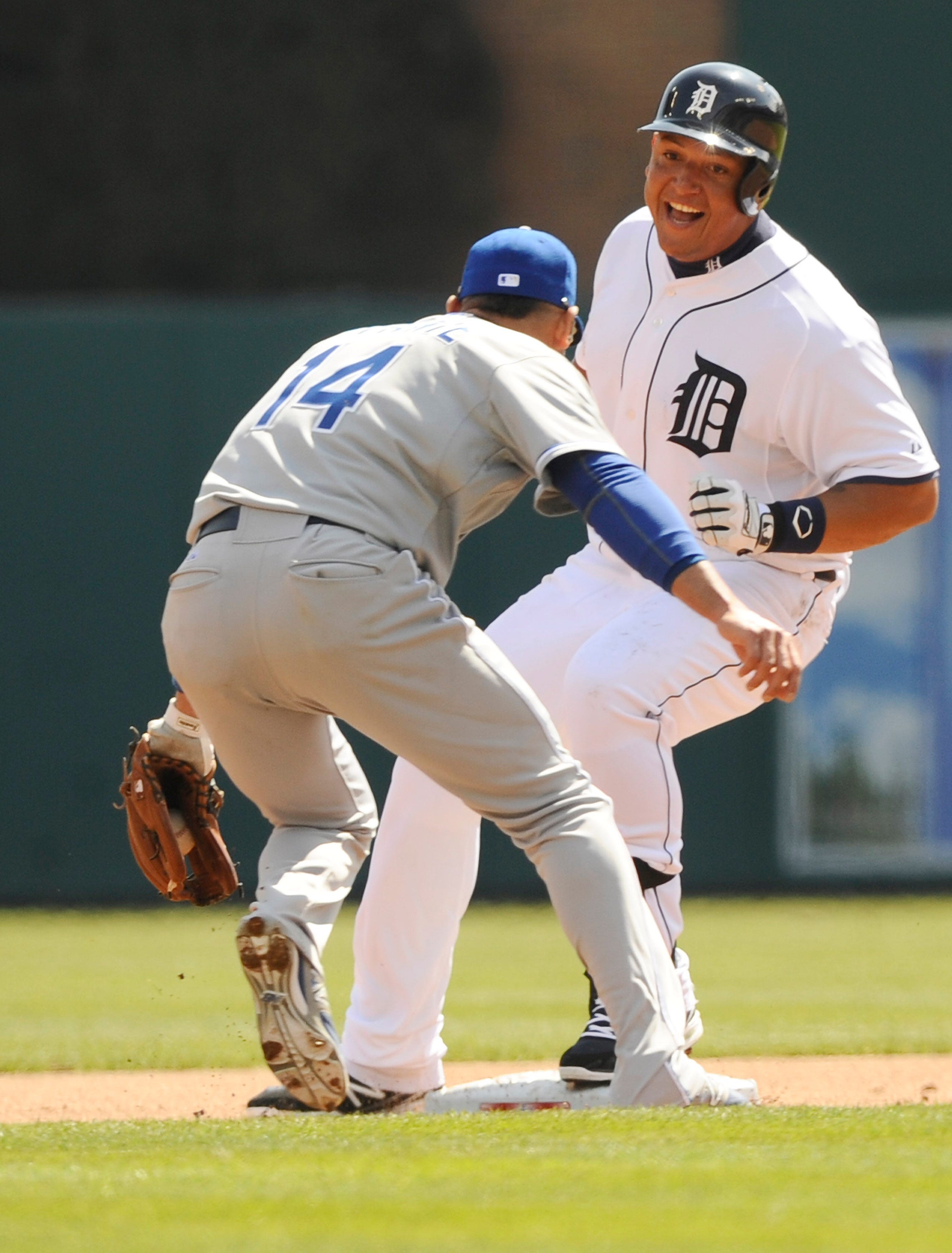 Tigers' Miguel Cabrera laughs at Kansas City's Omar Infante (14) as he's safe at second after hitting a double in fourth inning. Photos of Detroit Tigers Opening Day on Monday, March 31, 2014 at Comerica Park in Detroit.