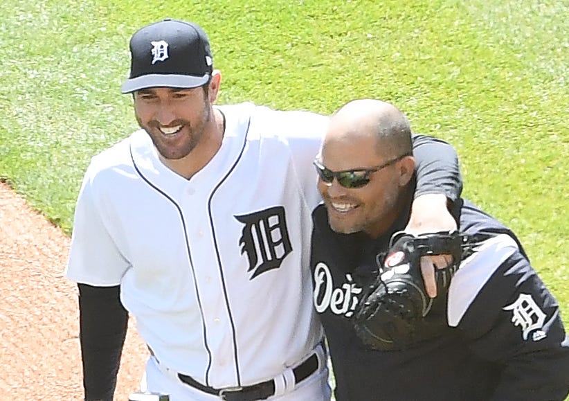 Tigers pitcher Justin Verlander and former Tigers catcher Ivan 'Pudge' Rodriguez greet each other after Verlander caught the ceremonial first pitch from Rodriguez. MLB Detroit Tigers opening day against the Boston Red Sox at Comerica Park in Detroit, Michigan on April 7, 2017.