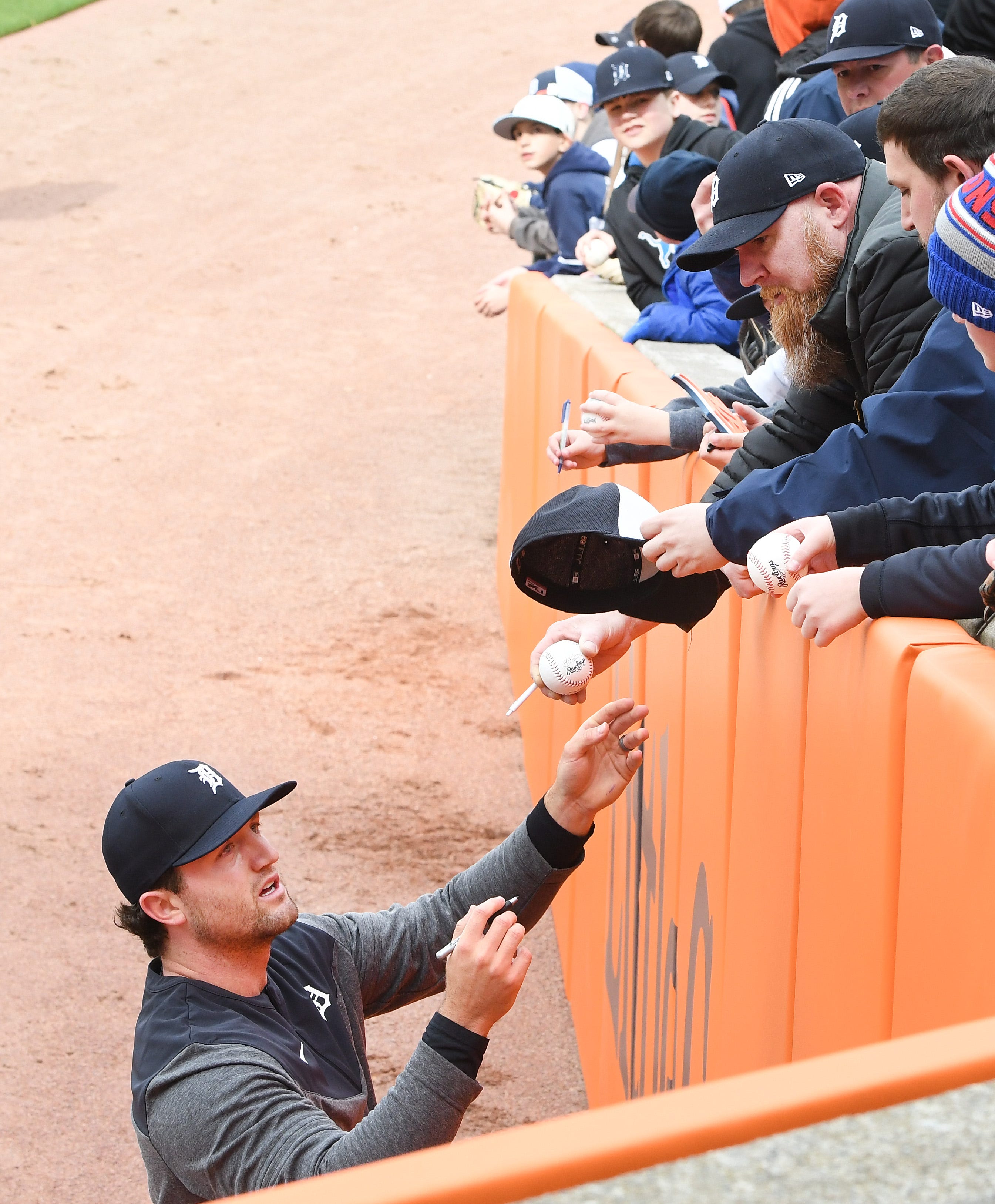 Tigers pitcher Casey Mize signs autographs in the outfield before the game. 
Detroit Tigers home opener at Comerica Park in Detroit, Michigan on April 6, 2023.