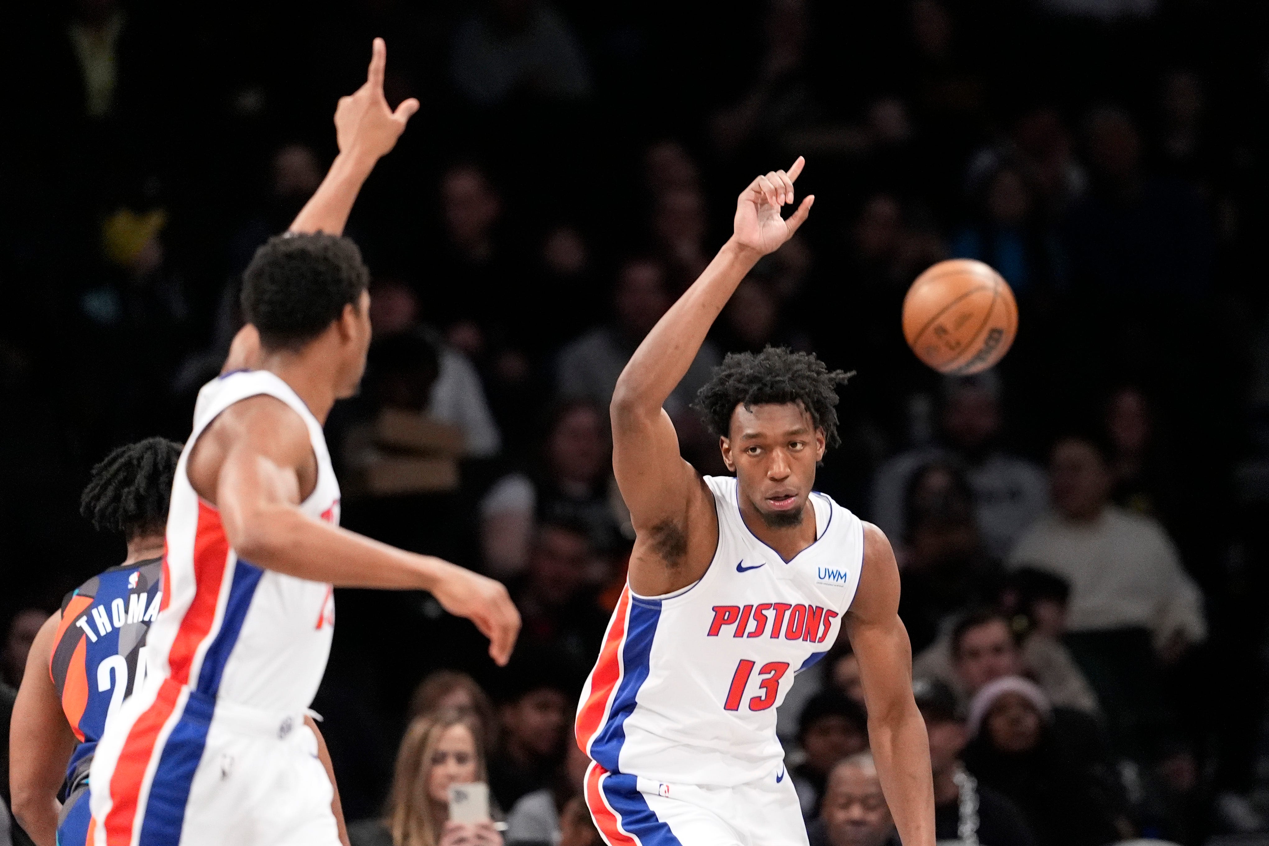 Pistons center James Wiseman (13) and guard Jaden Ivey, left, react during the first half.