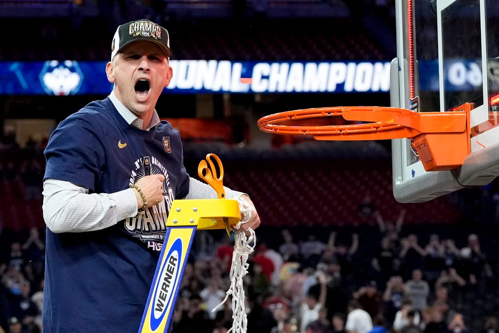 UConn head coach Dan Hurley celebrates cutting the net after their win against Purdue in the NCAA college Final Four championship basketball game on Monday in Glendale, Ariz.