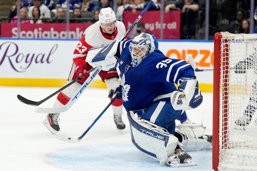 Maple Leafs goaltender Ilya Samsonov (35) makes a save on a shot from Red Wings left wing Lucas Raymond (23) during the third period.