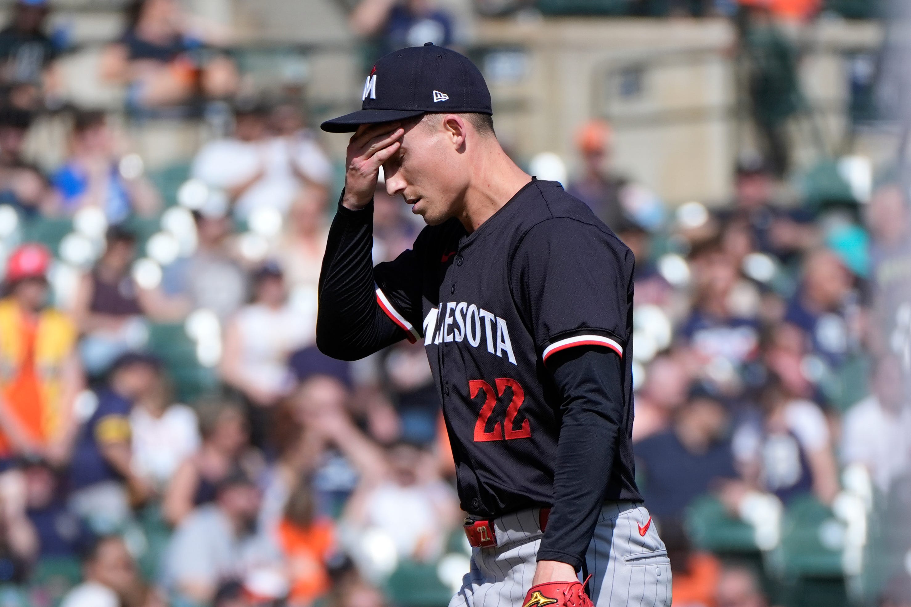 Minnesota Twins pitcher Griffin Jax (22) walks to the dugout in the eighth inning of a baseball game against the Detroit Tigers, Sunday, April 14, 2024, in Detroit. (AP Photo/Paul Sancya)