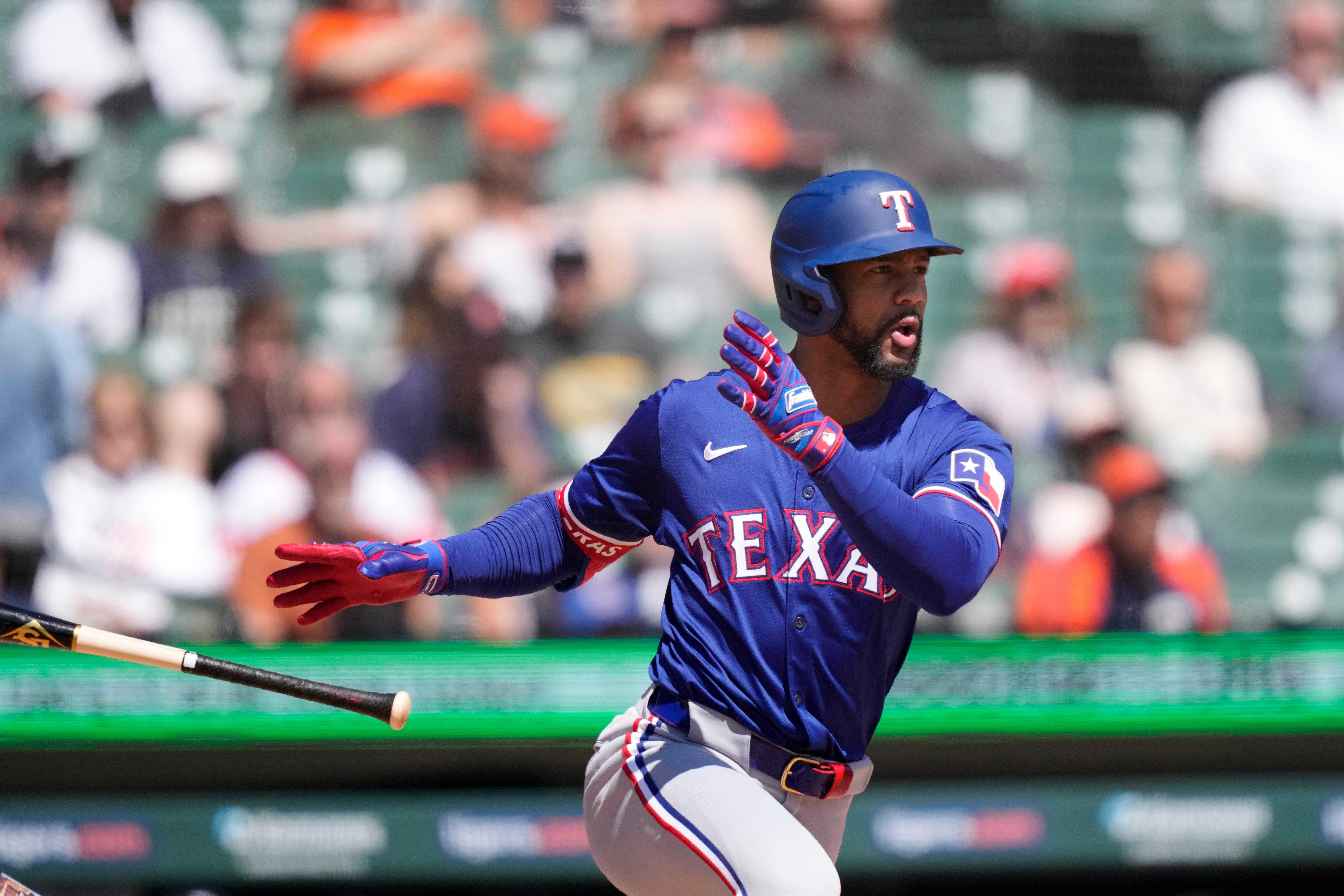 Texas Rangers' Marcus Semien connects for a RBI single to center during the fifth inning.