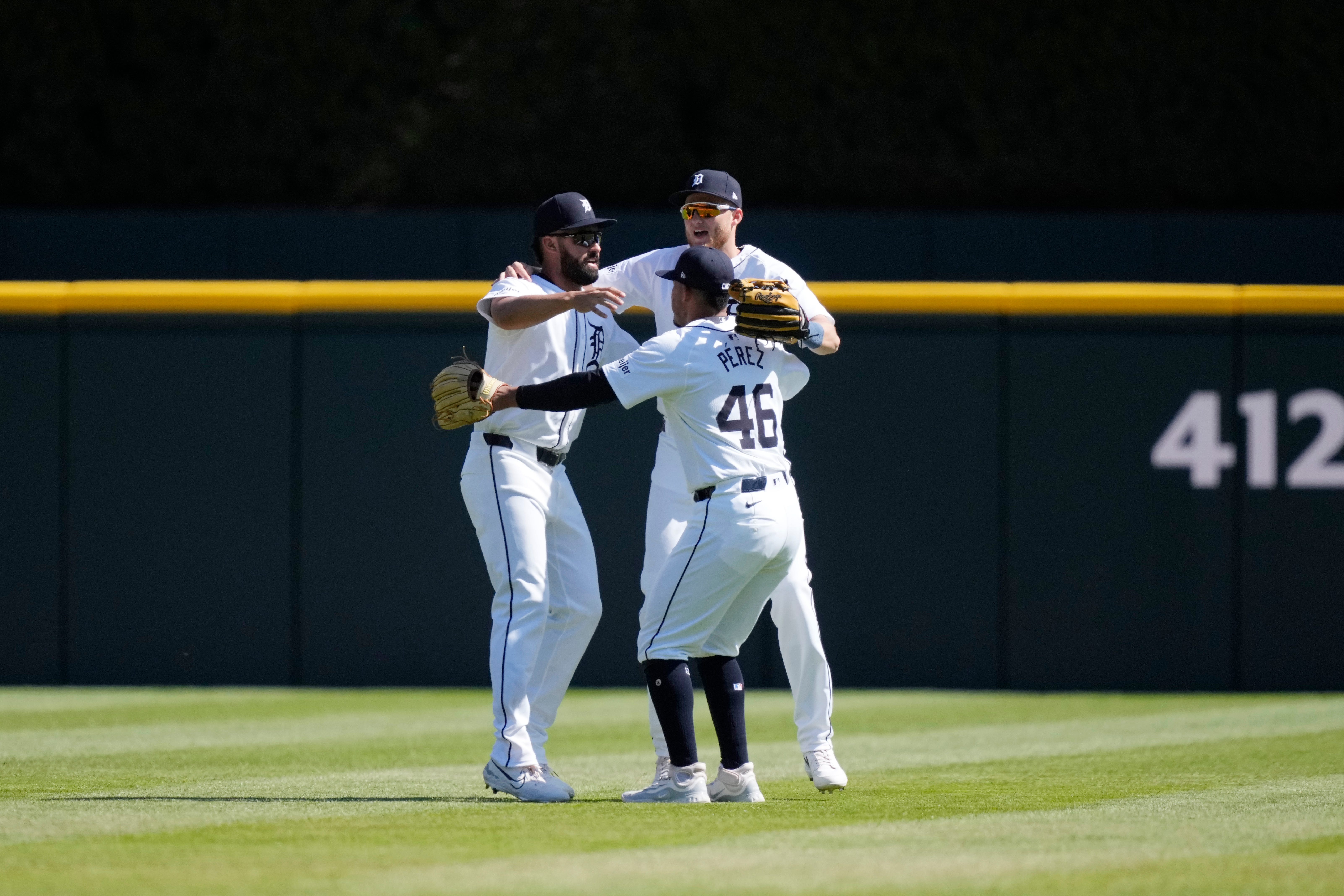 Detroit Tigers outfielders Wenceel Perez (46), Riley Greene, left, and Parker Meadows hug after the ninth inning.