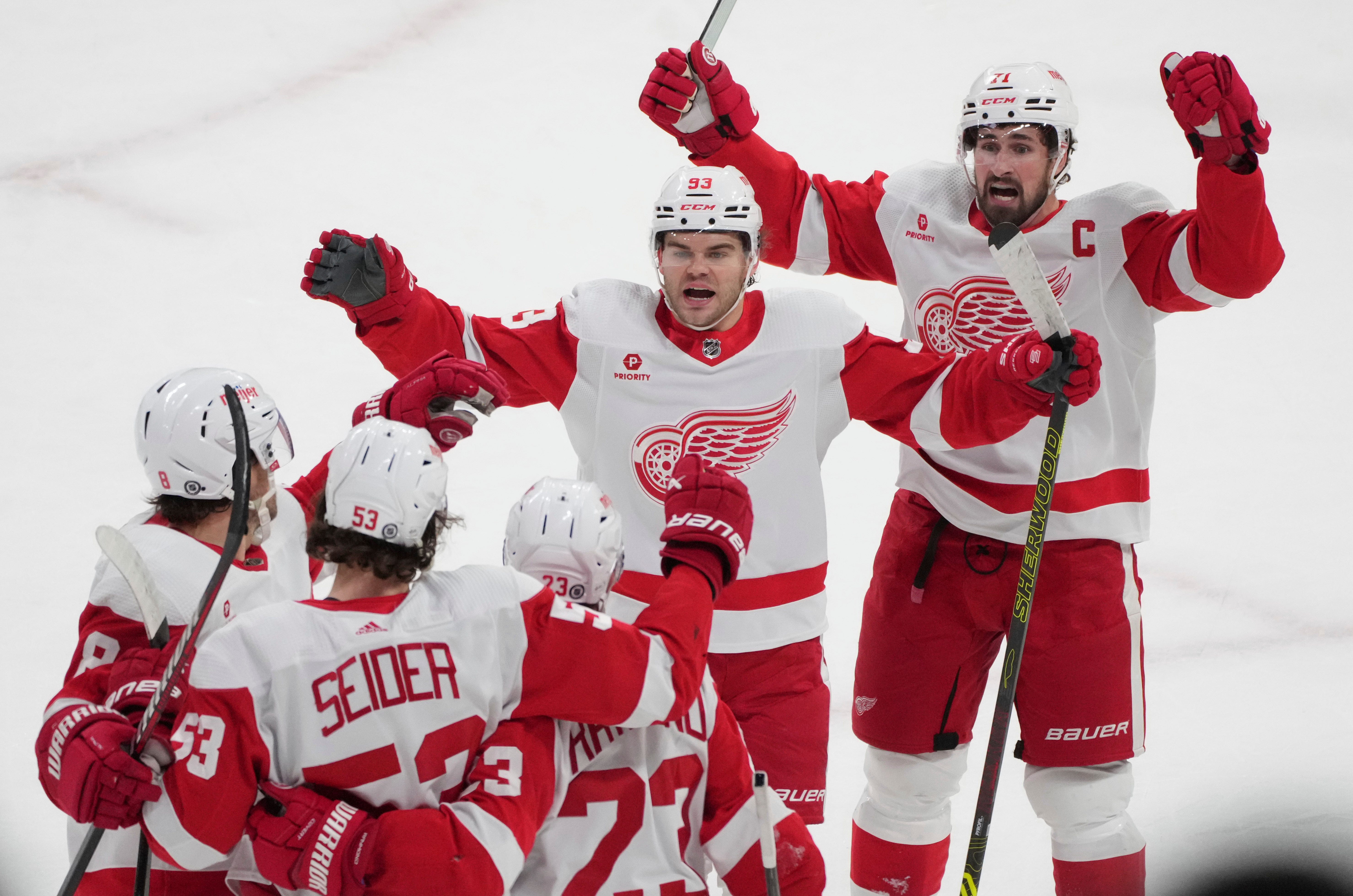 Detroit Red Wings' Moritz Seider (53) celebrates with teammates after his goal against the Montreal Canadiens during the first period.