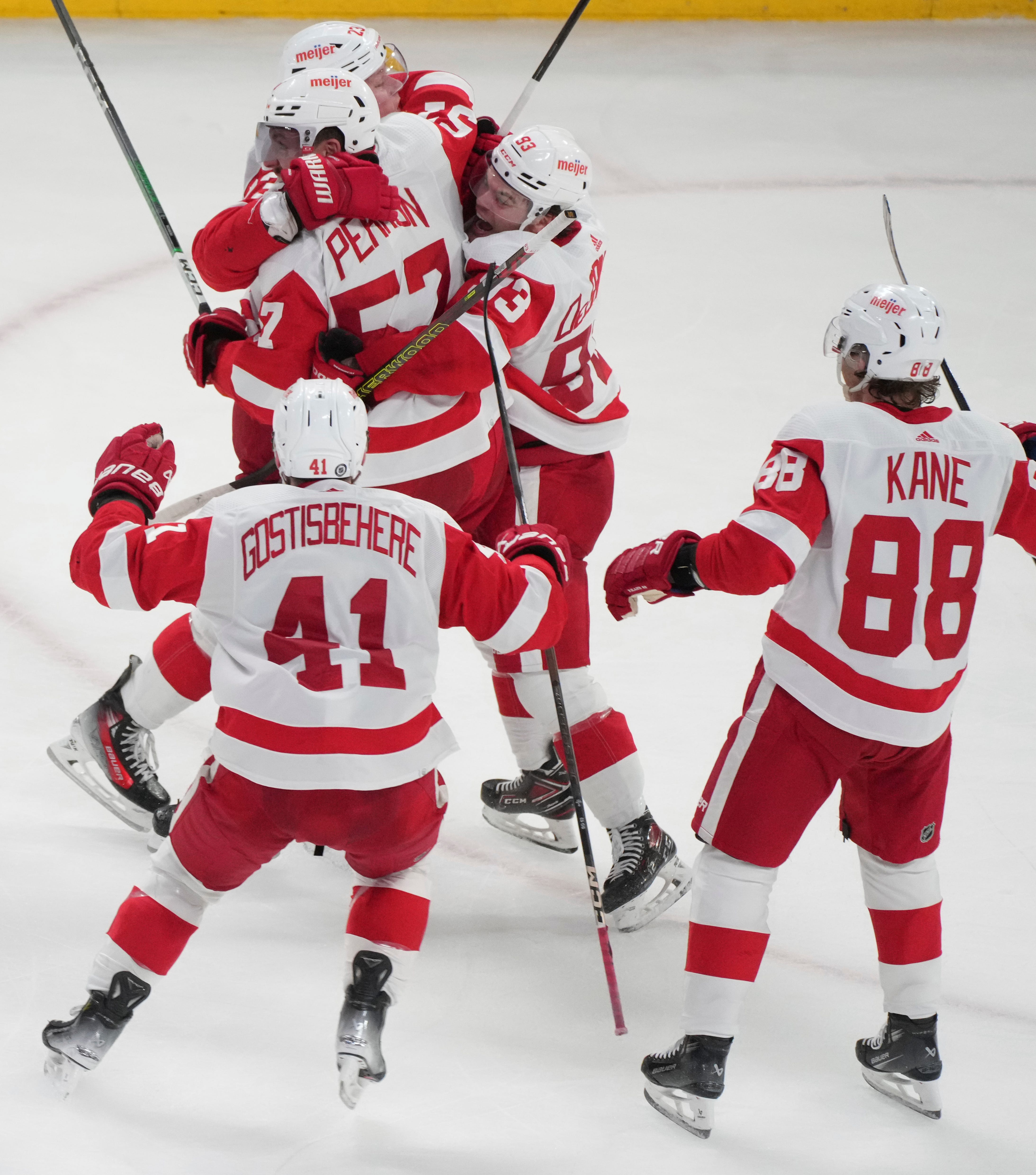 Detroit Red Wings' David Perron (57) celebrates his game-tying goal over the Montreal Canadiens with teammates during the final moments of the third period.