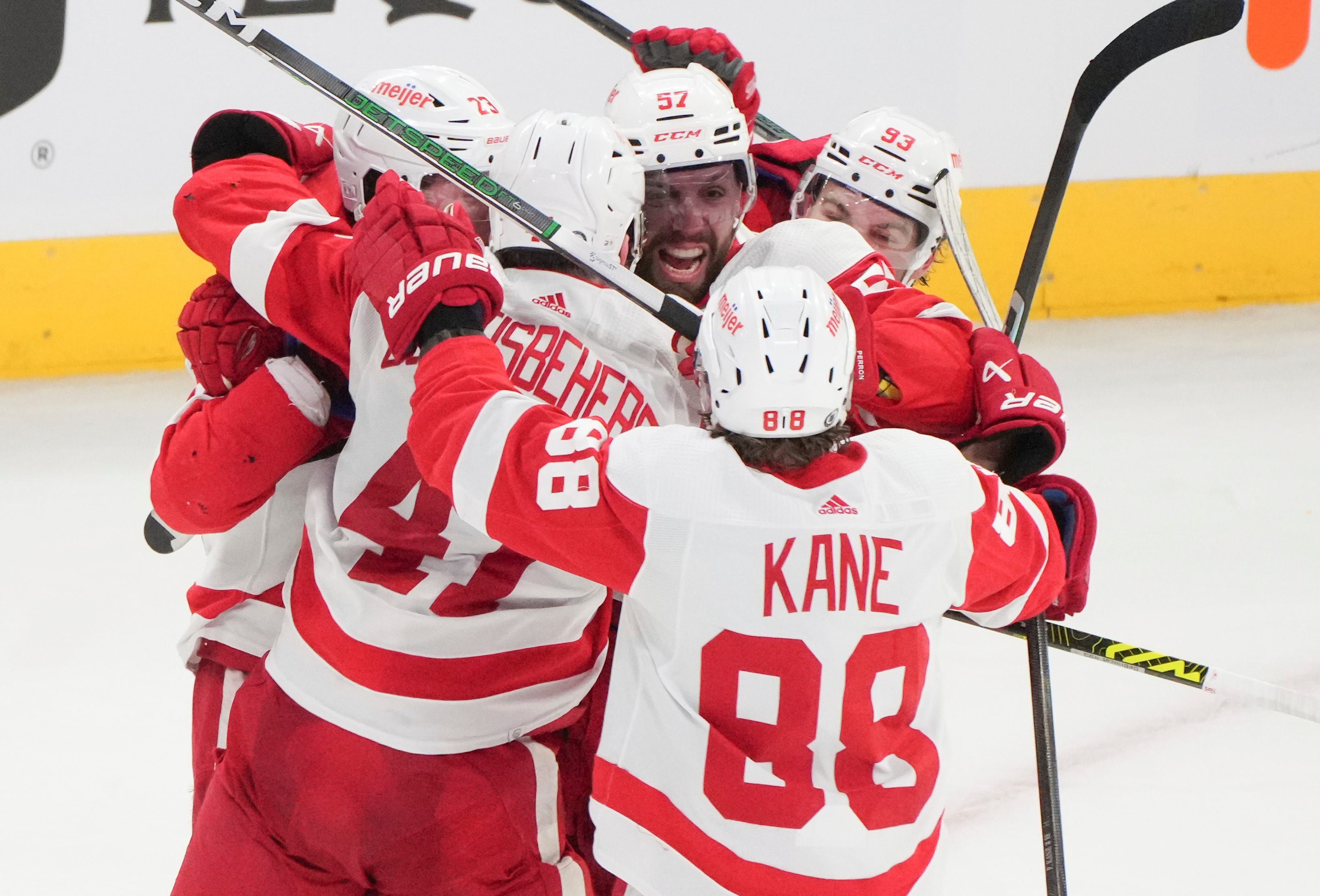 Detroit Red Wings' David Perron (57) celebrates his game-tying goal over the Montreal Canadiens with teammates during the final seconds of the third period.