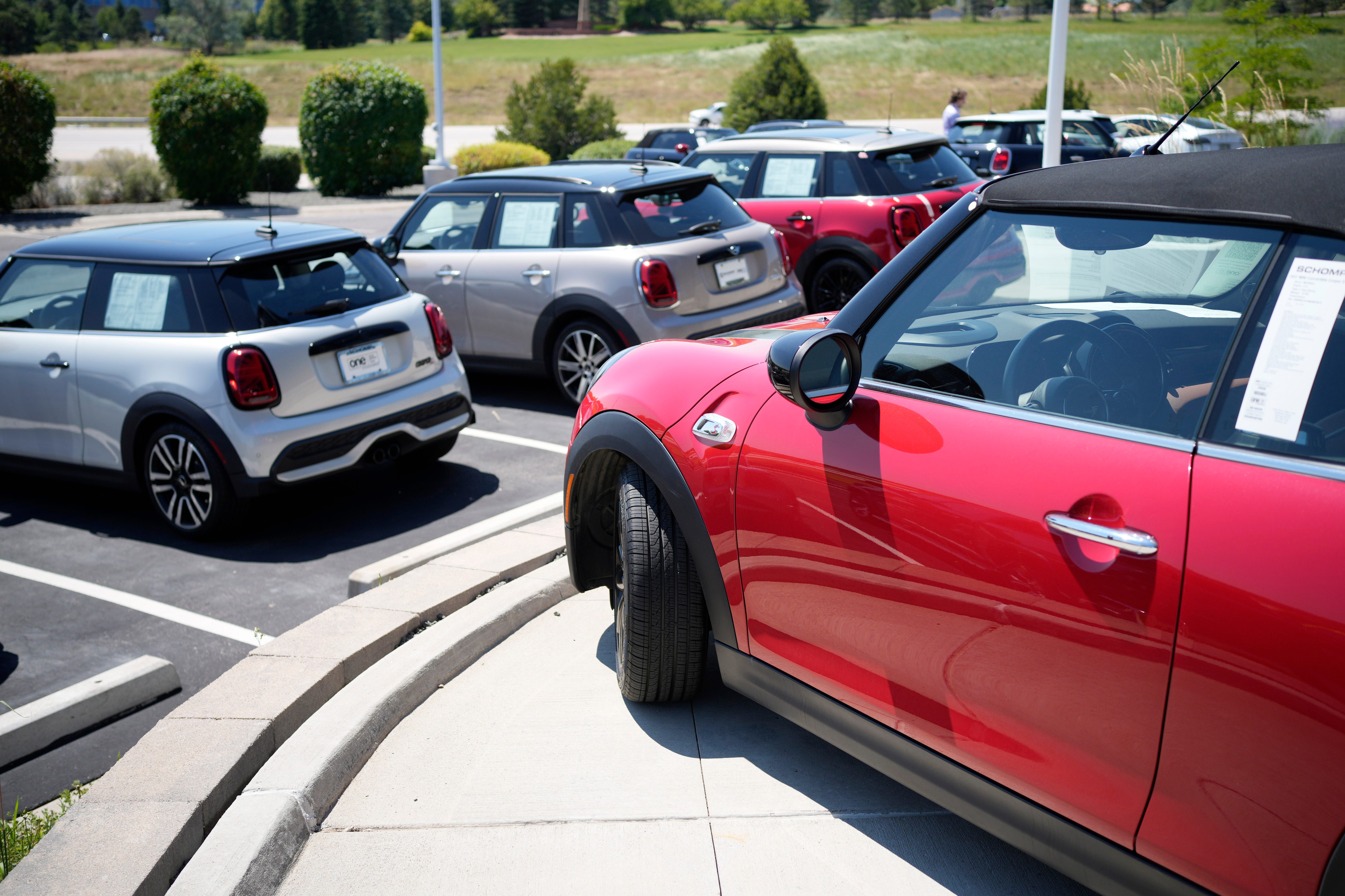 Used models are shown a Mini dealership on July 21, 2023, in Highlands Ranch, Colo. More people are buying used vehicles online sight-unseen but there are pitfalls to doing so.
